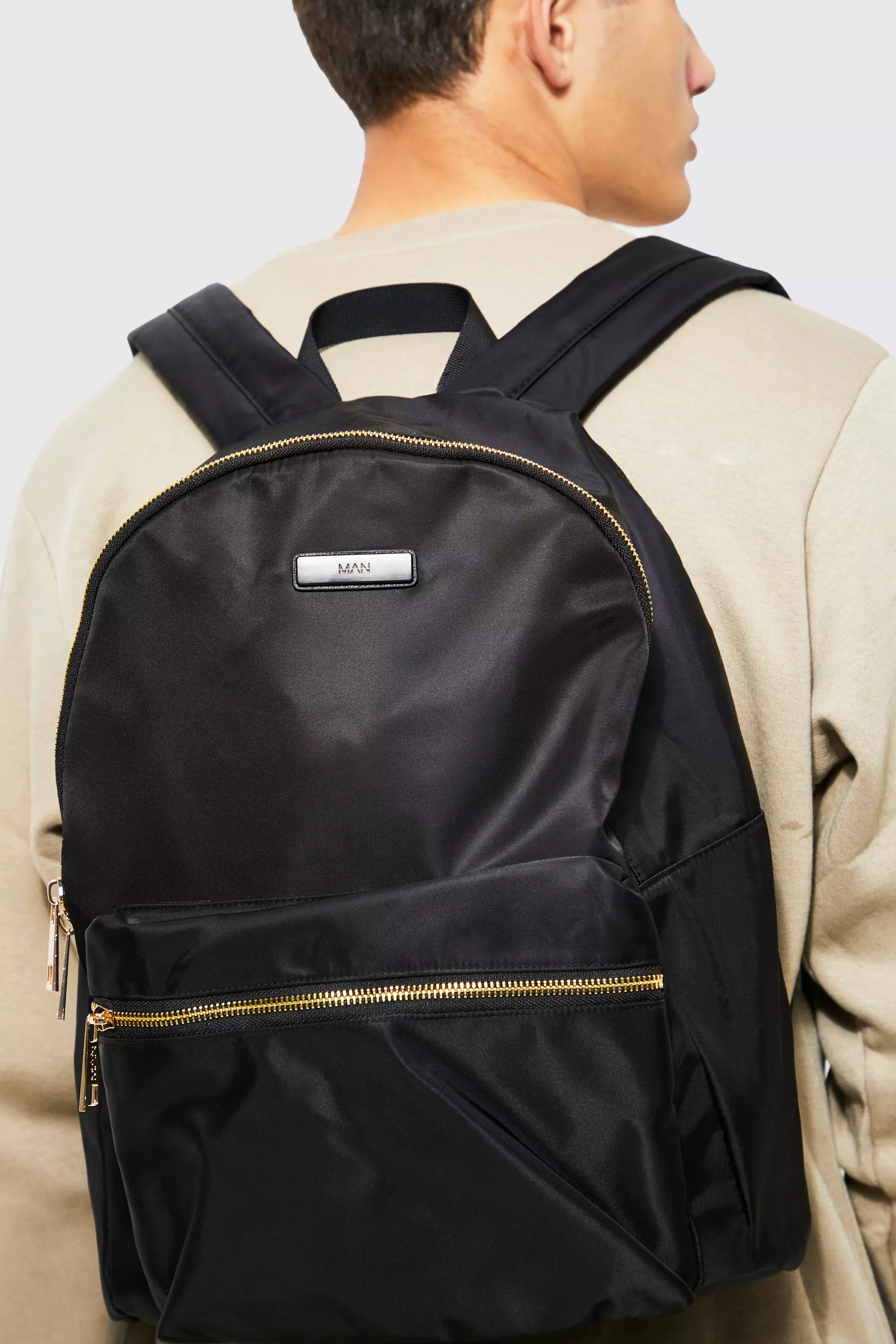 Black backpack gold zip hotsell