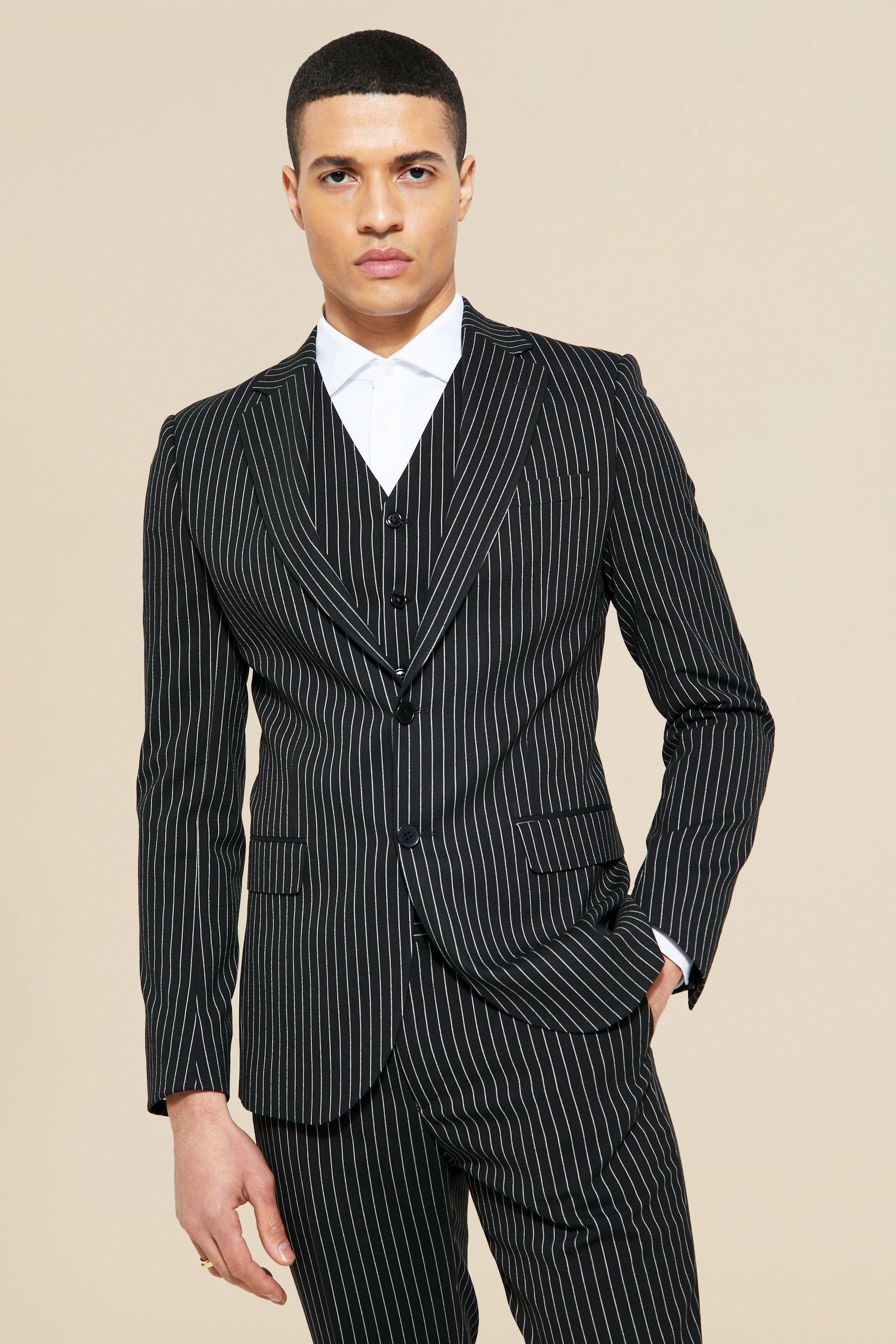 Why You Should Own A Pinstripe Suit (And How To Wear It)