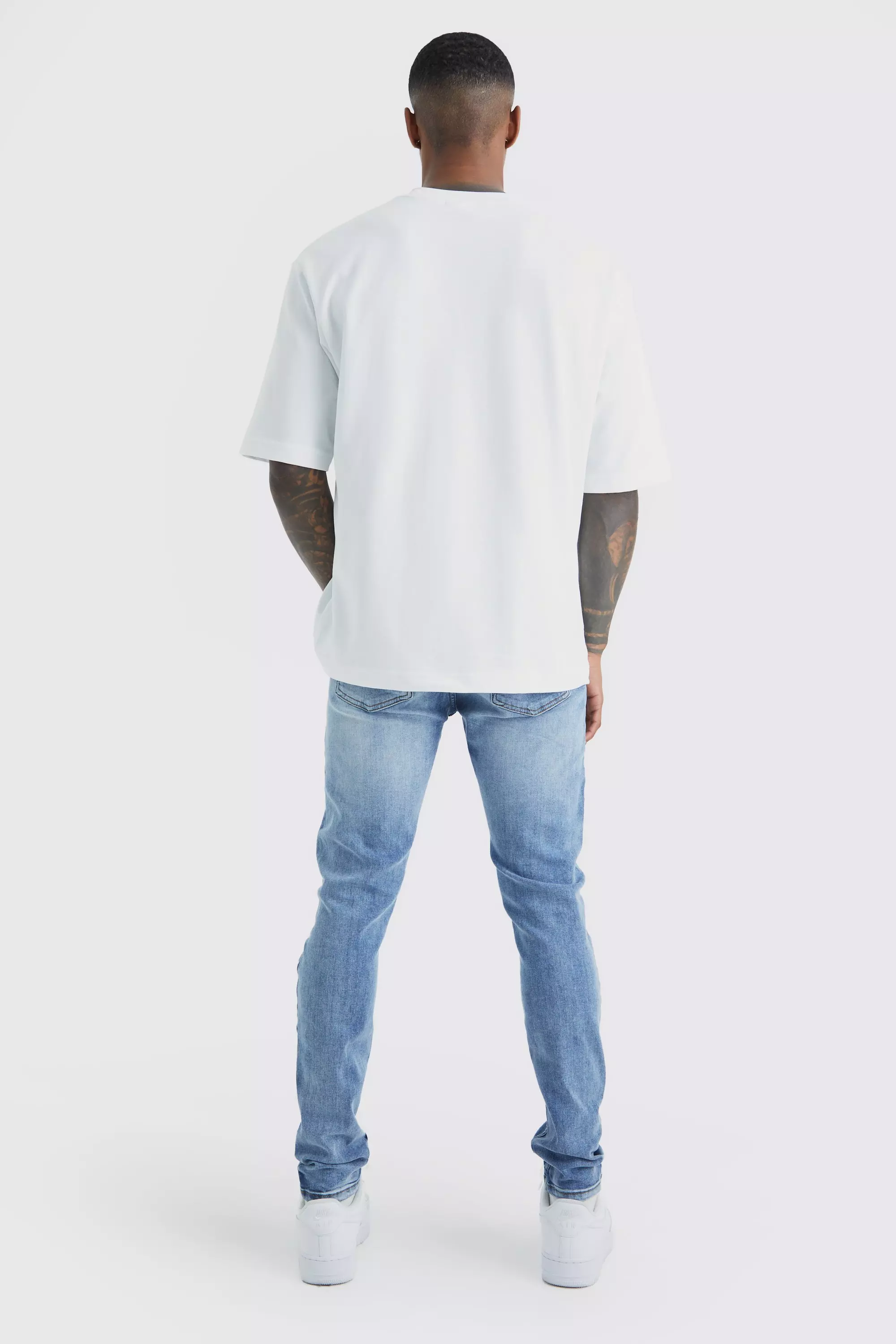 Skinny Stretch Bleached Ripped Knee Jeans | boohooMAN UK