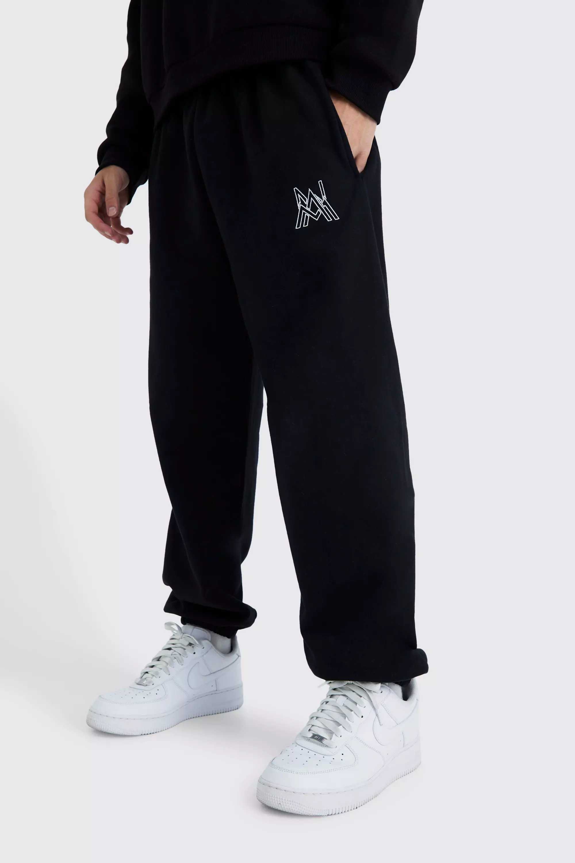 Black oversized tracksuit bottoms hotsell