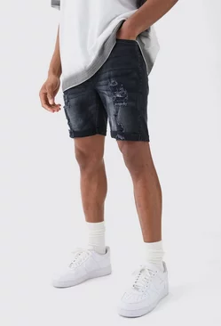 Black Skinny Stretch Distressed Denim Shorts In Washed Black