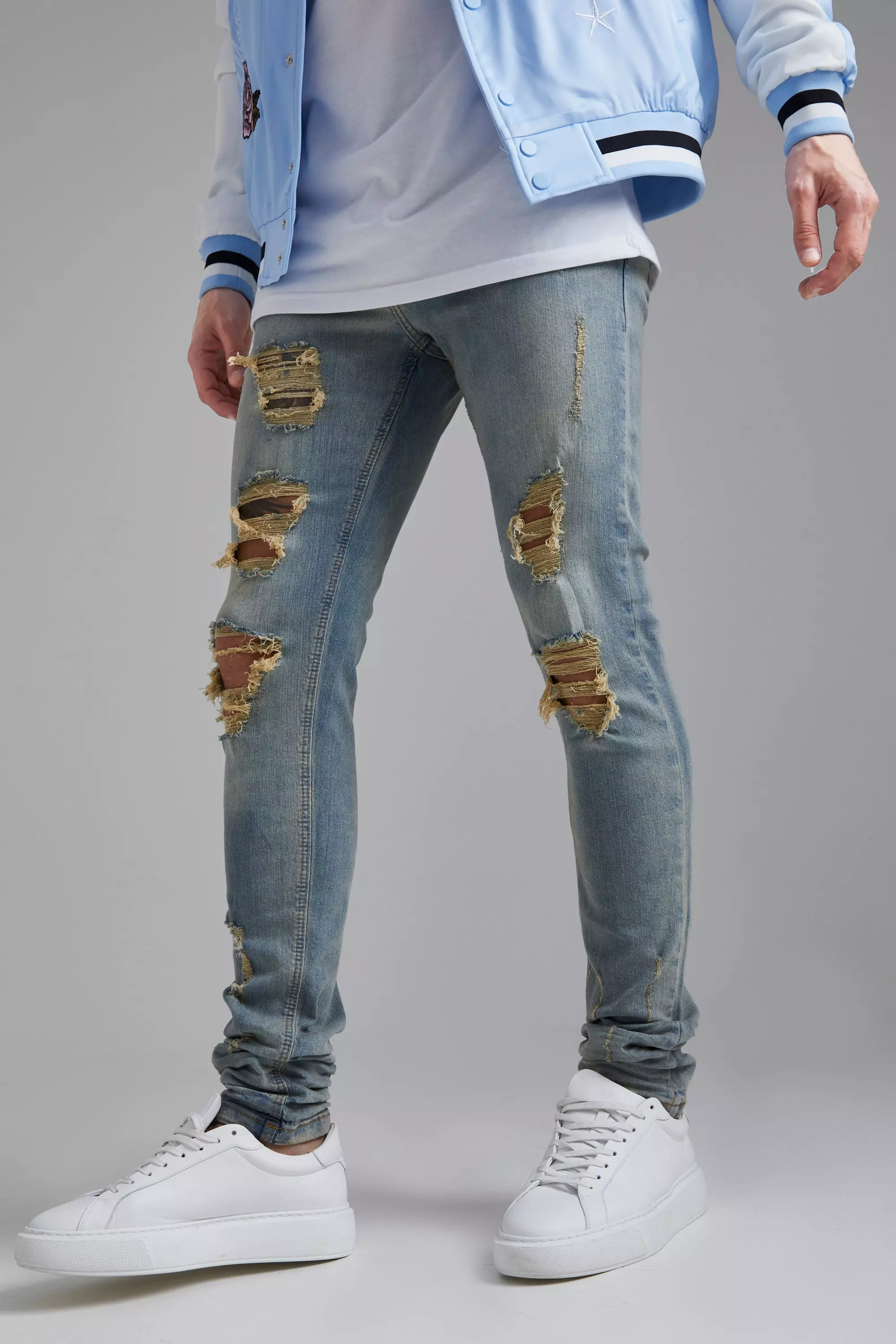 Blue Skinny Stretch Stacked Rip Hem Detail Jean