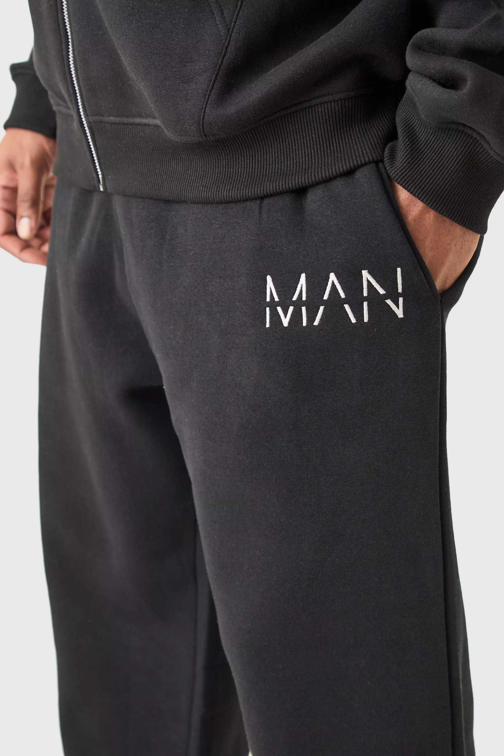 Plus lockere Man-Dash Jogginghose in Schwarz, Black alternatives Bild