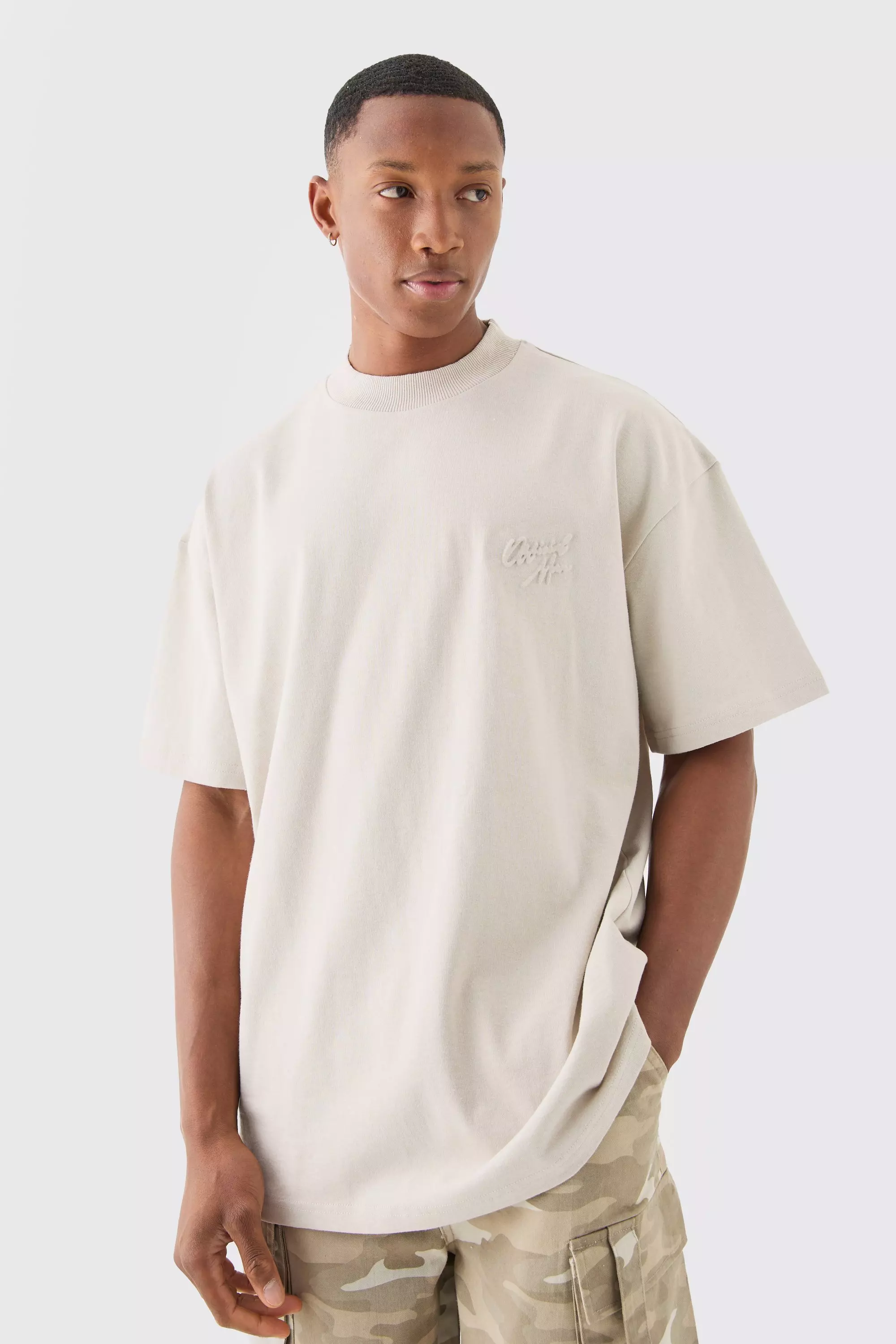 Stone Beige Oversized Extended Neck Official Man Embossed T-shirt