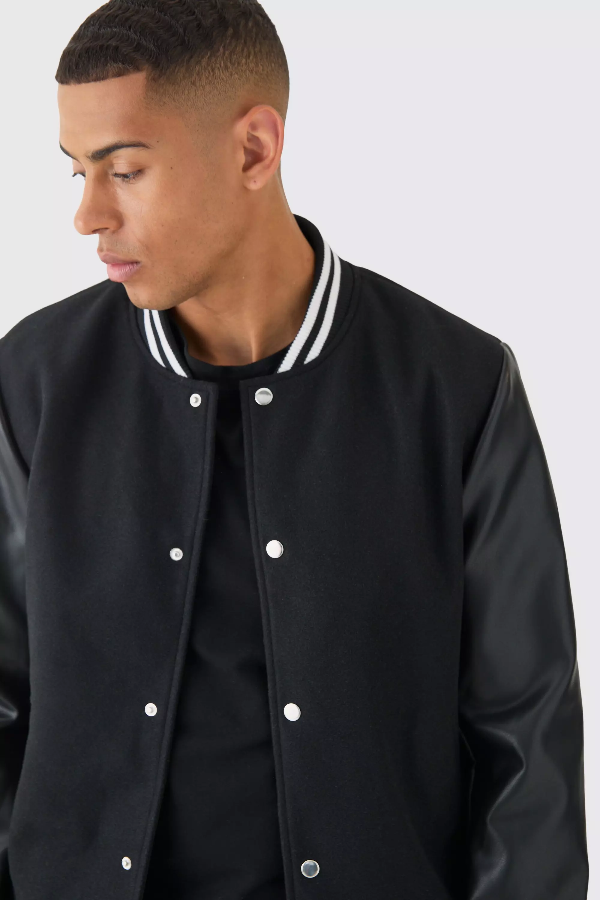 Plain Melton And Pu Sleeve Varsity Jacket In Black boohooMAN IE