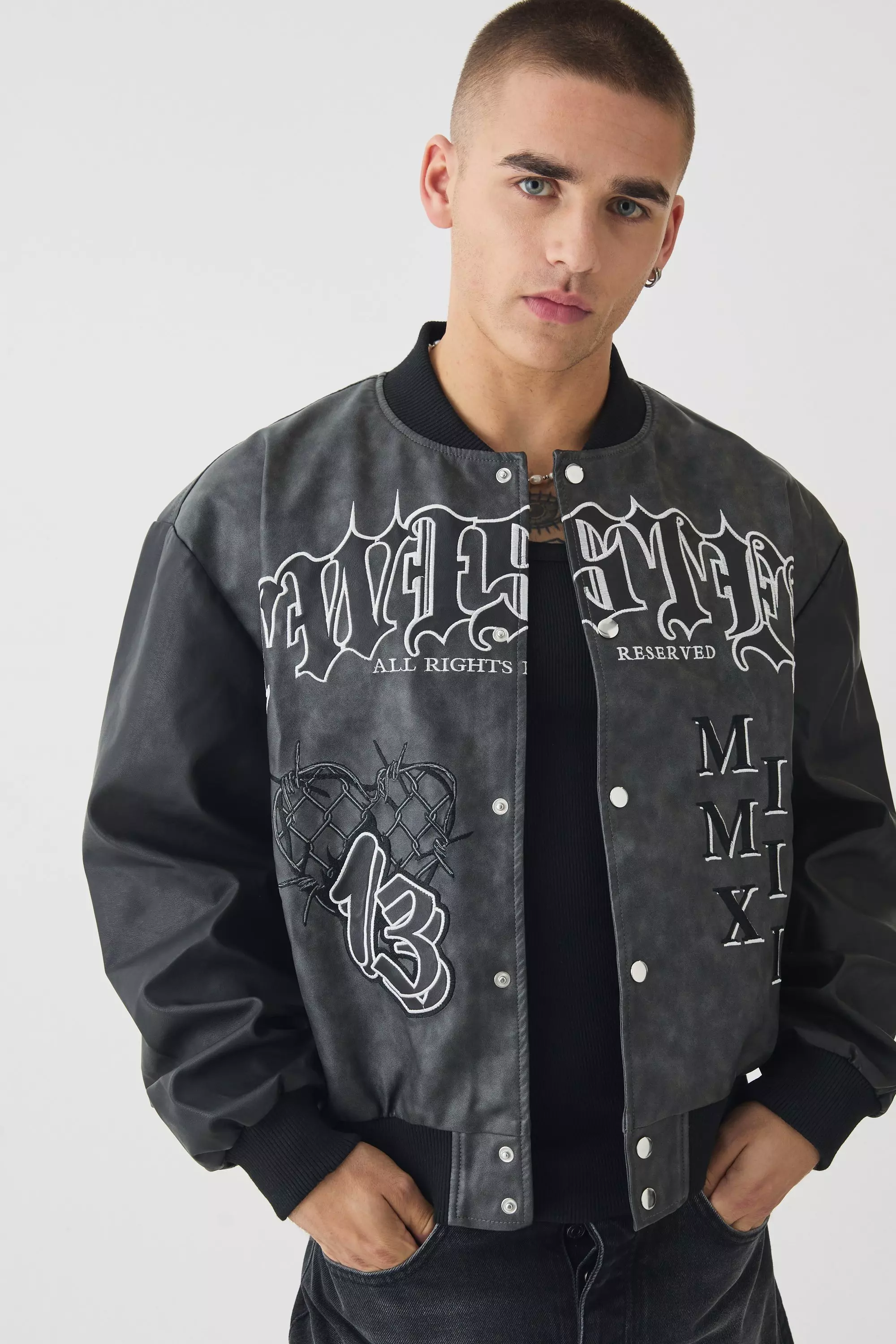 Boxy Tonal Badge Tumbled Pu Varsity Jacket In Black Black