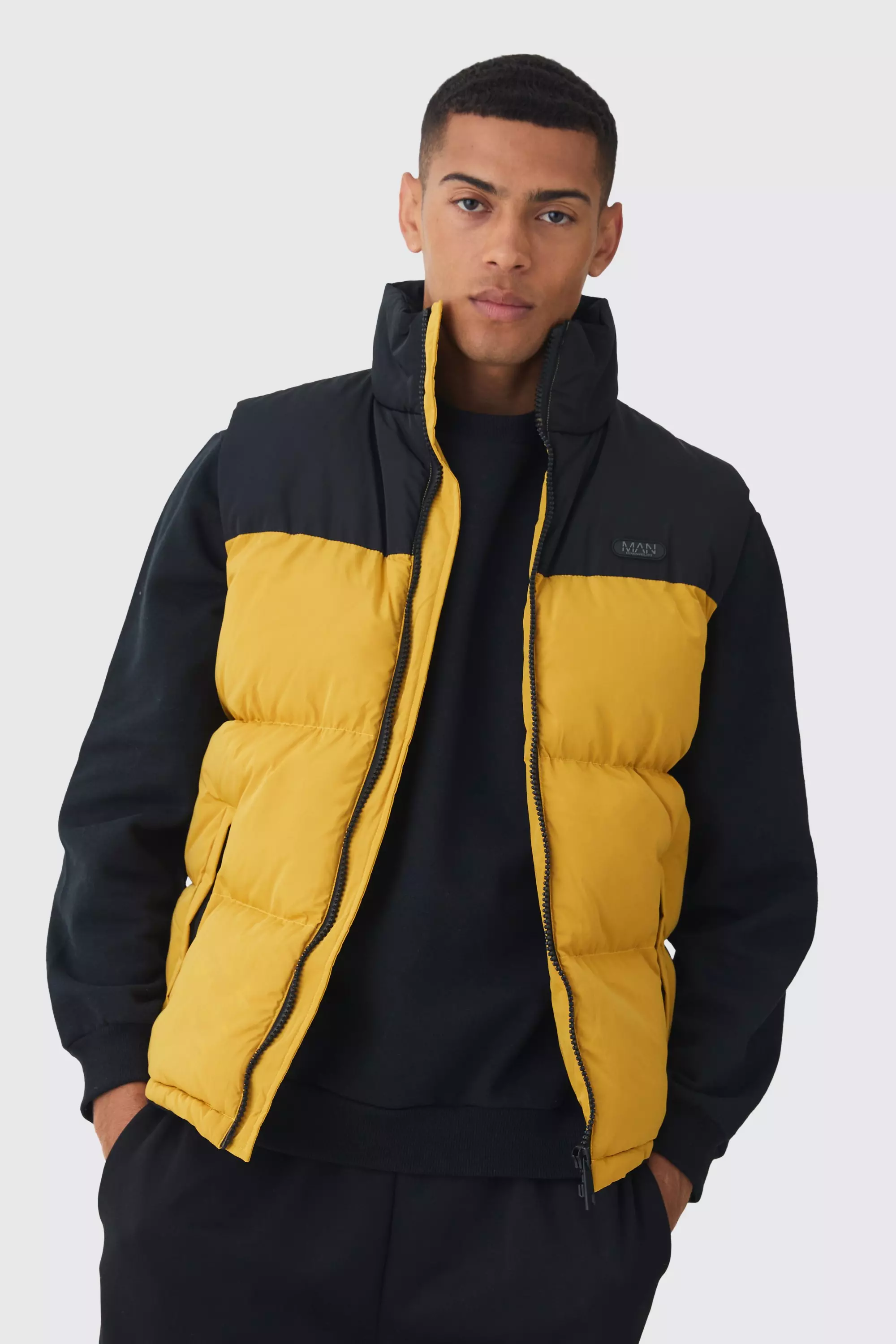 Man Tab Colour Block Puffer Funnel Neck Vest In Mustard Mustard