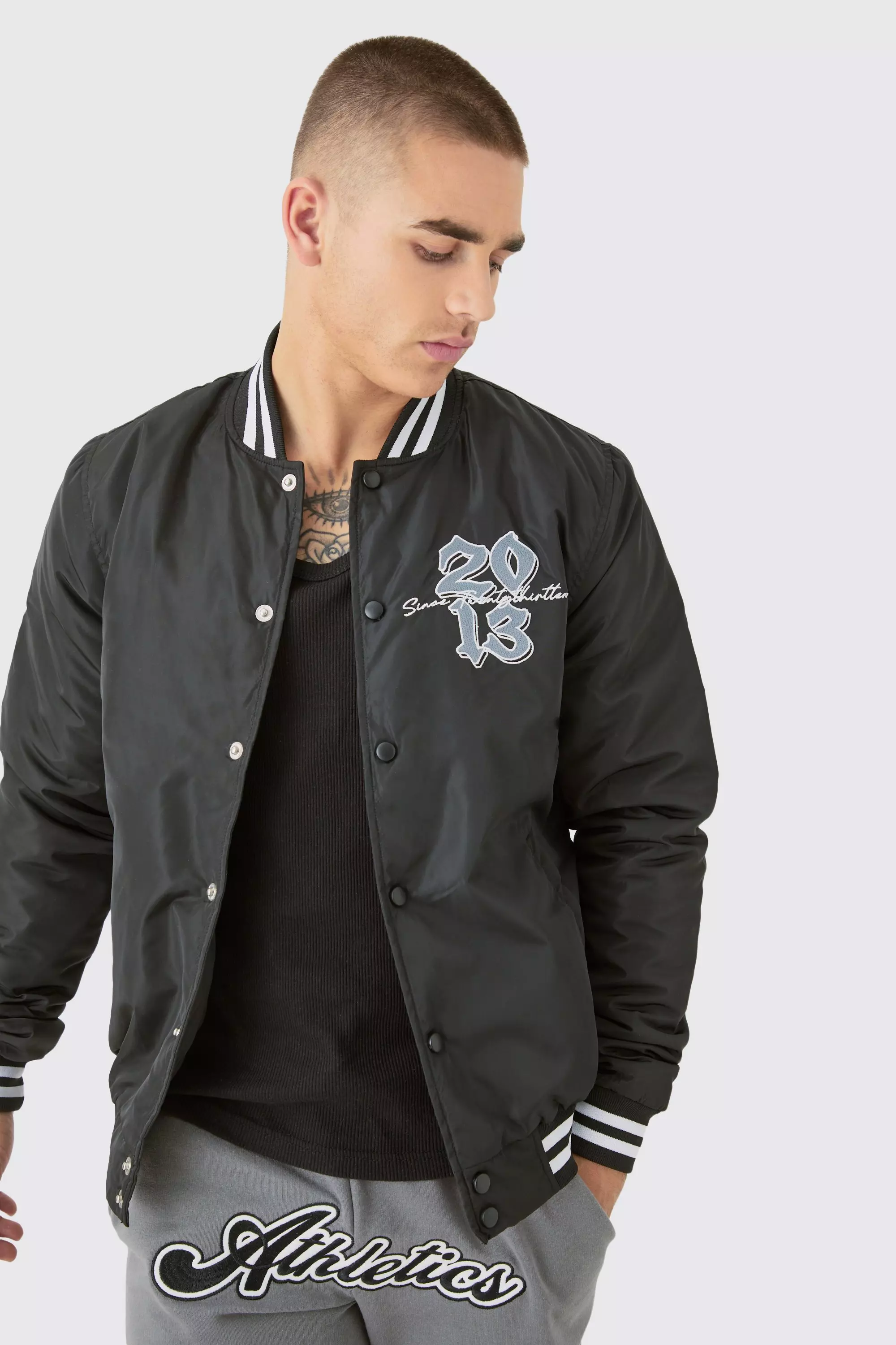 Official Badge Nylon Varsity Bomber Jacket In Black Black