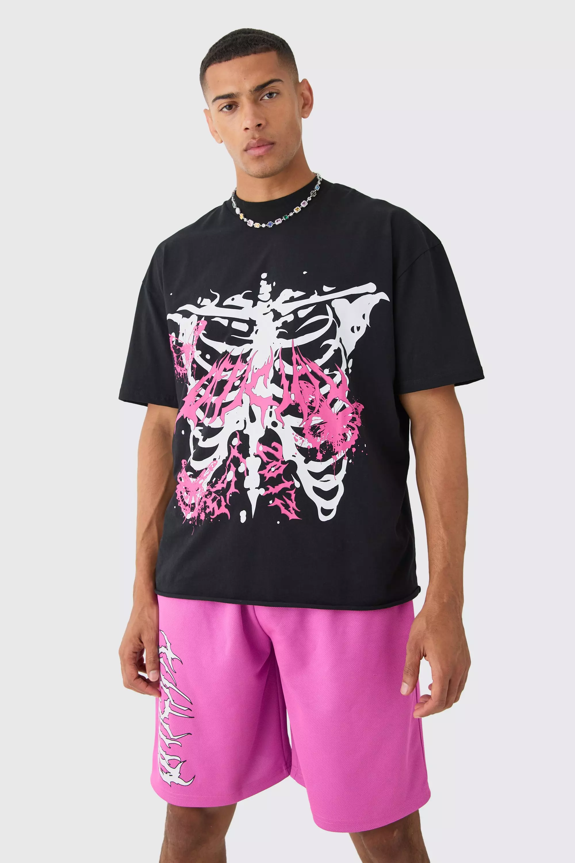 Oversized Extended Neck Raw Hem Skeleton T-shirt And Mesh Shorts Set Pink