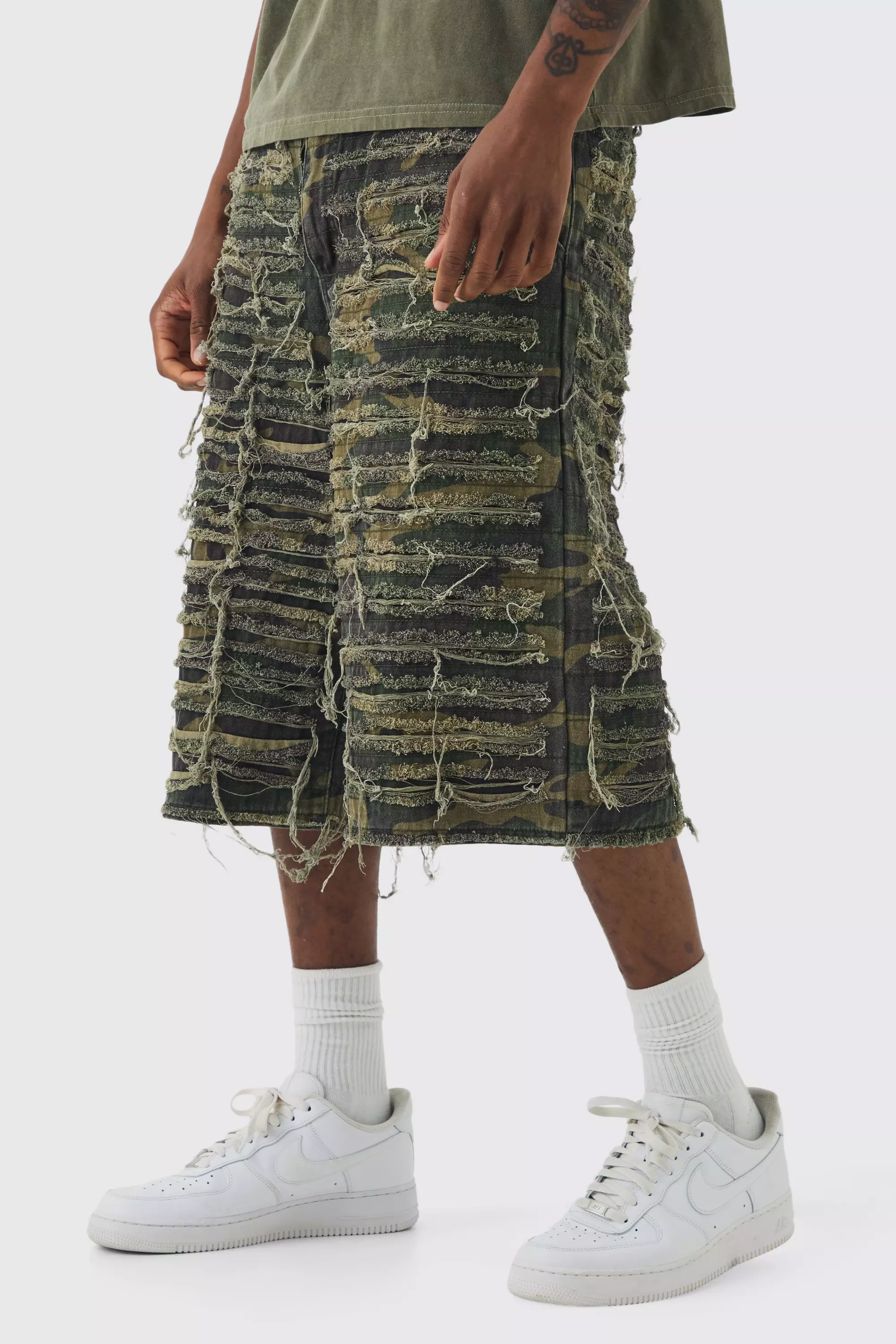 Distressed camo shorts deals
