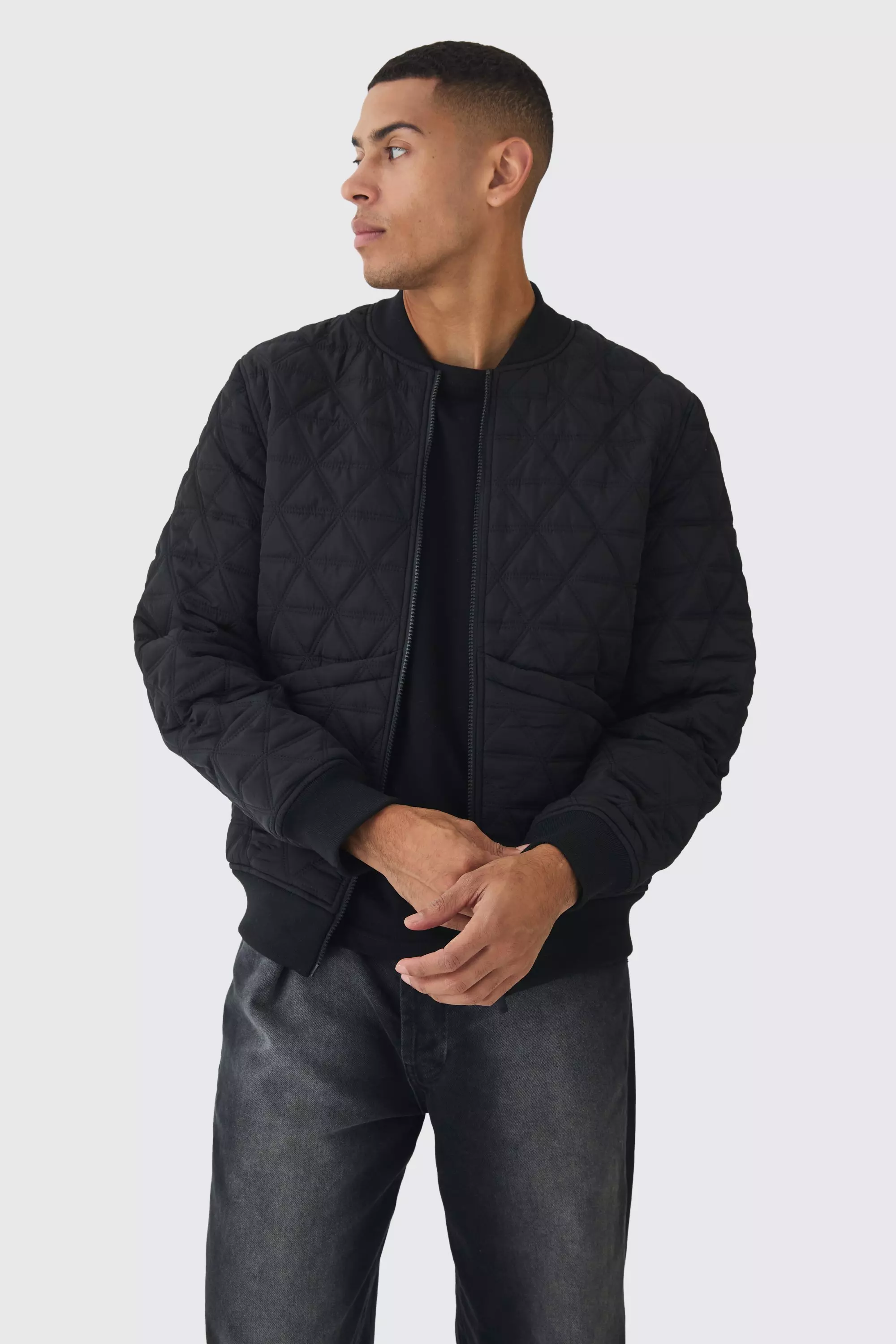 Black Quilted Bomber Jacket In Black