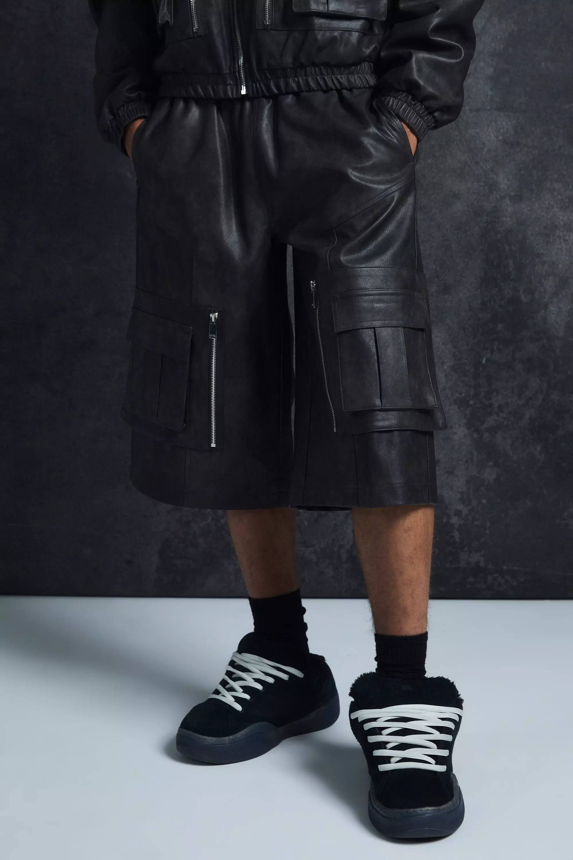 Trippie Redd Relaxed Longline Washed Pu Cargo Jorts In Black Black