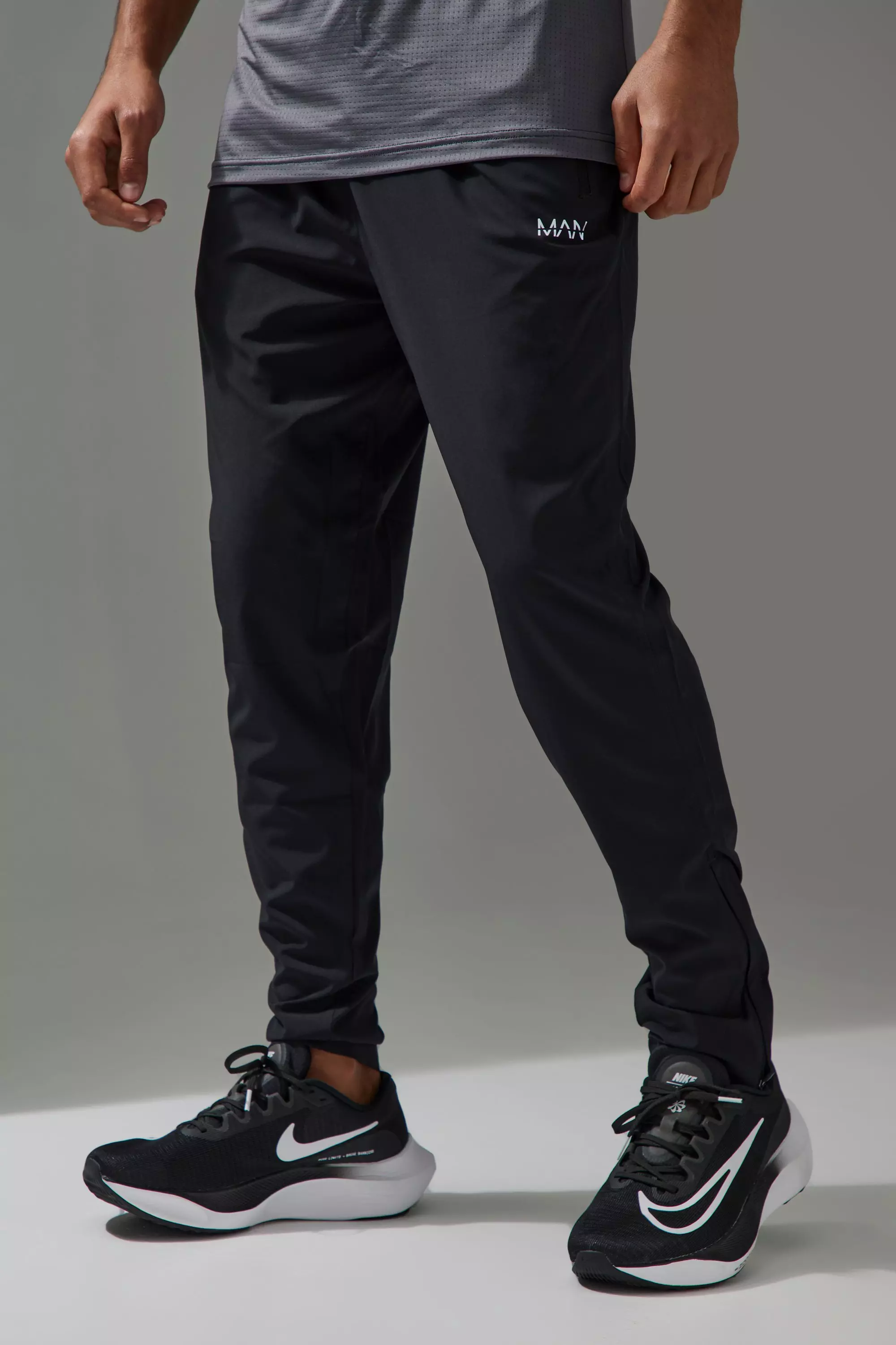 Man Active Performance Lightweight Stretch Woven Tapered Sweatpants | boohooMAN USA