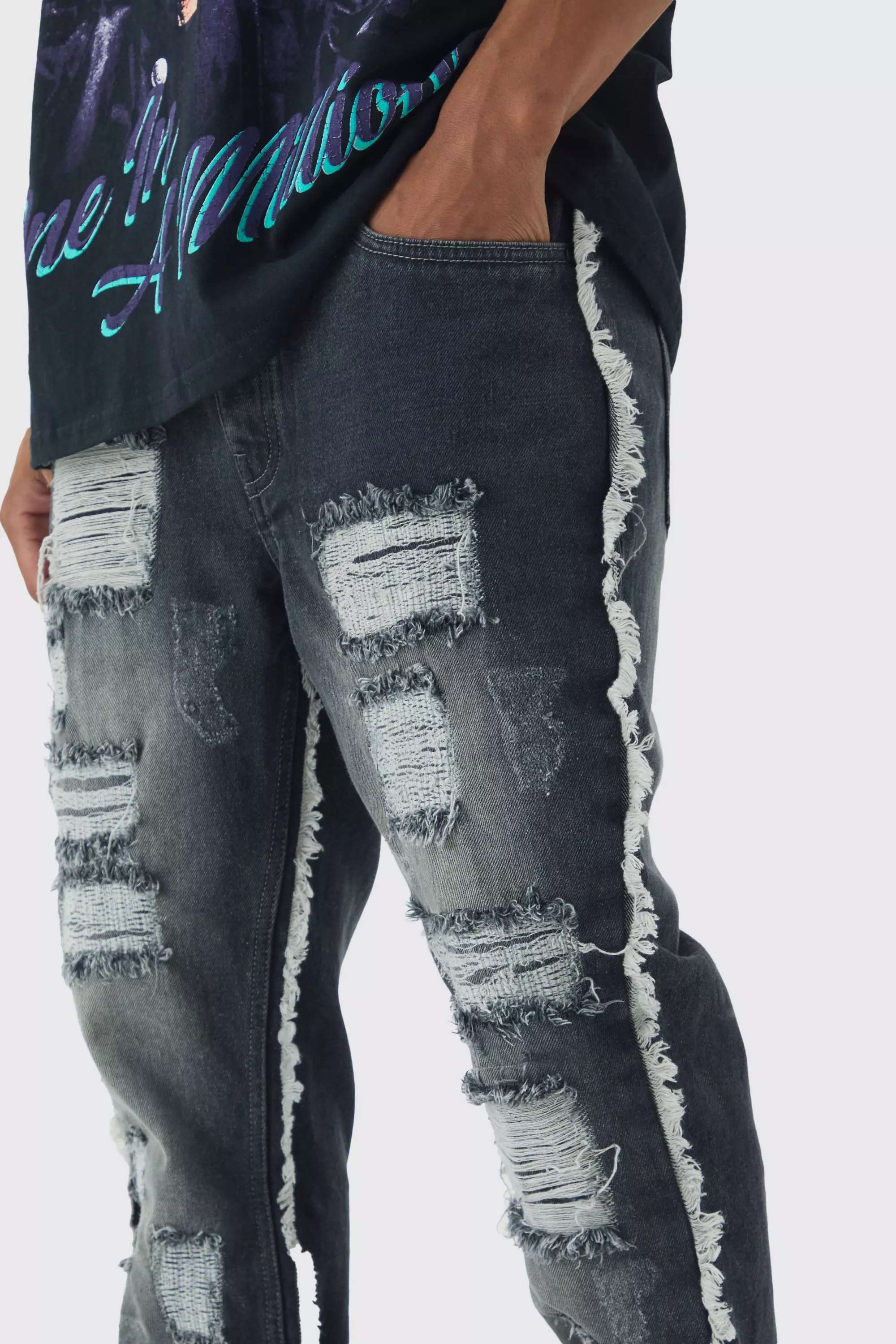 Slim Flared All Over Ripped Jeans With Let Down Hem | boohooMAN USA