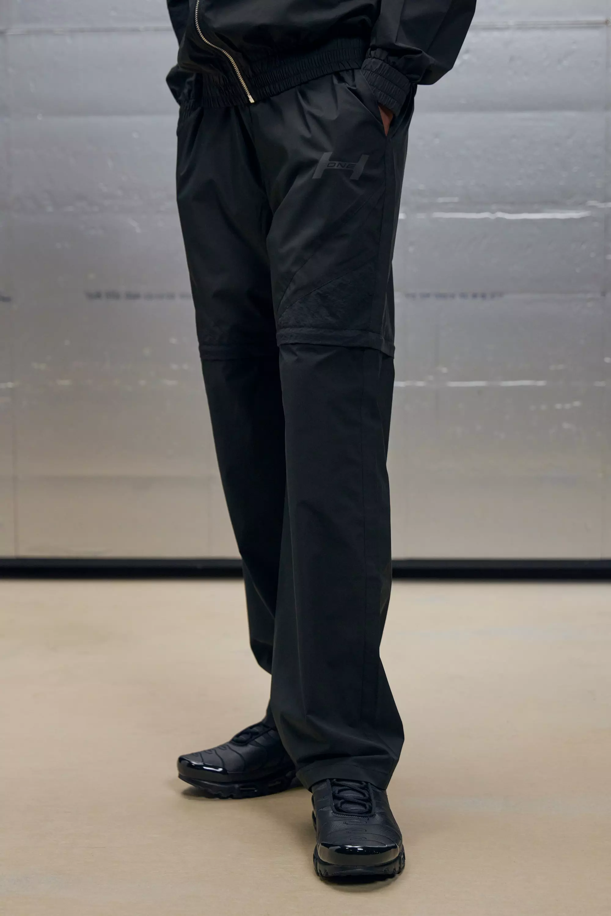 Black Relaxed Fit Crinkle Nylon Panelled Zip Off Pants