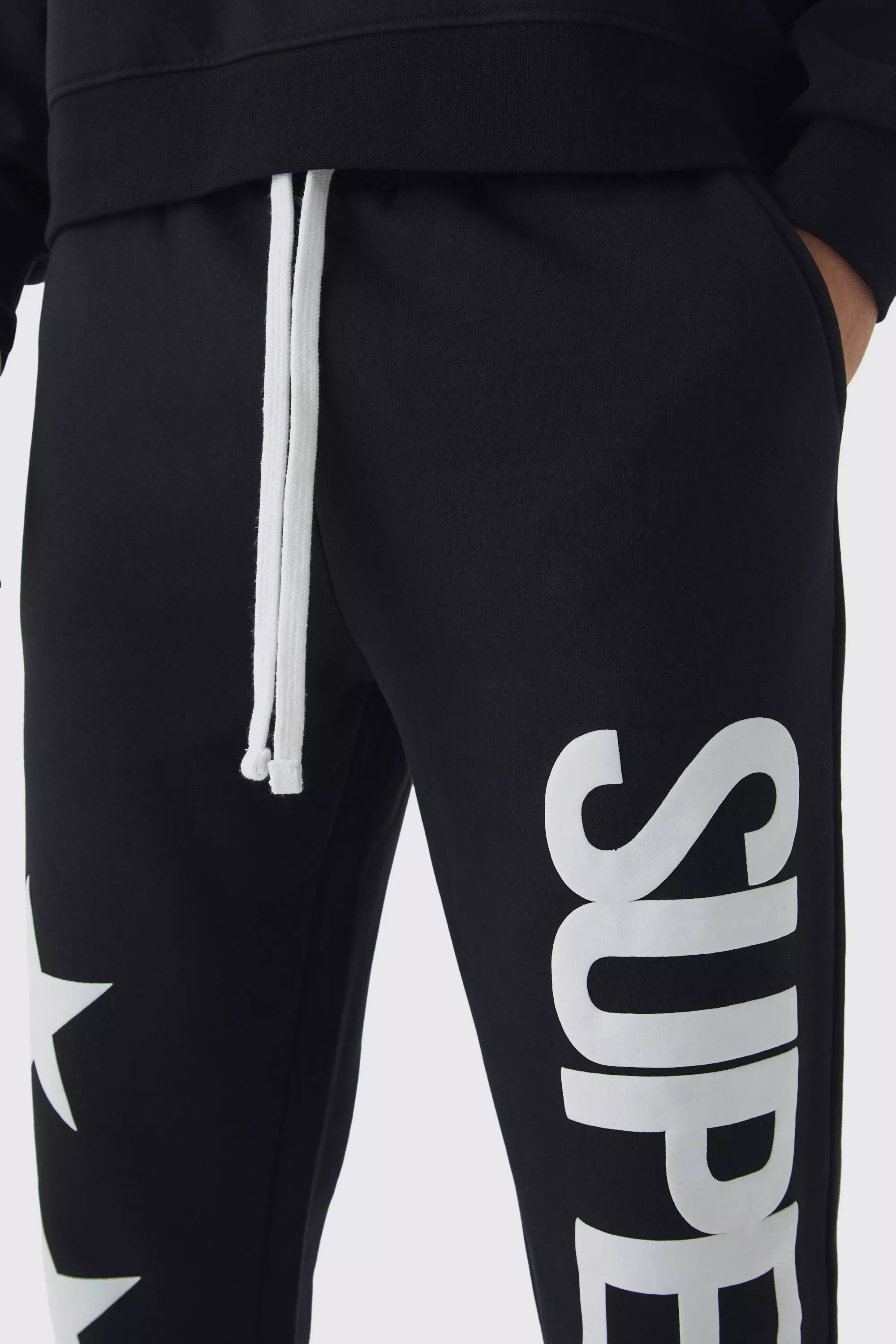 Slim-Fit Schlag-Jogginghose mit Superstar-Print, Black alternatives Bild