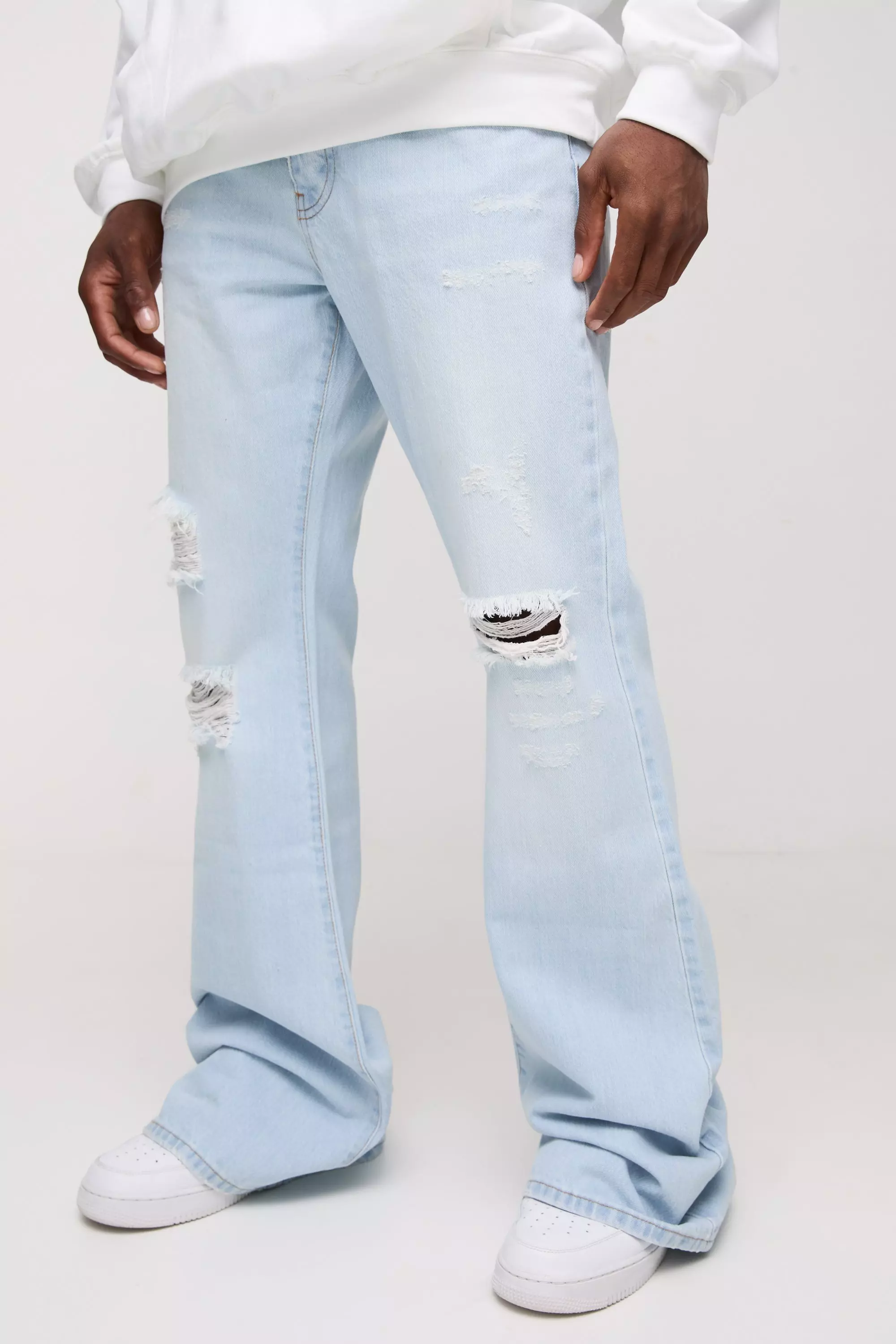 Relaxed Rigid Flare Stacked Knee Rip Denim Jeans | boohooMAN USA