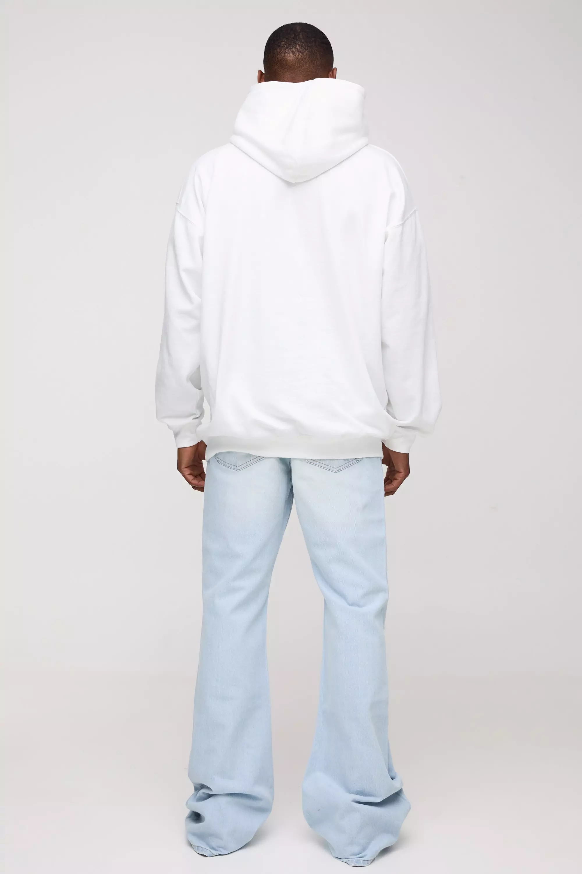 Relaxed Rigid Flare Stacked Knee Rip Denim Jeans | boohooMAN USA