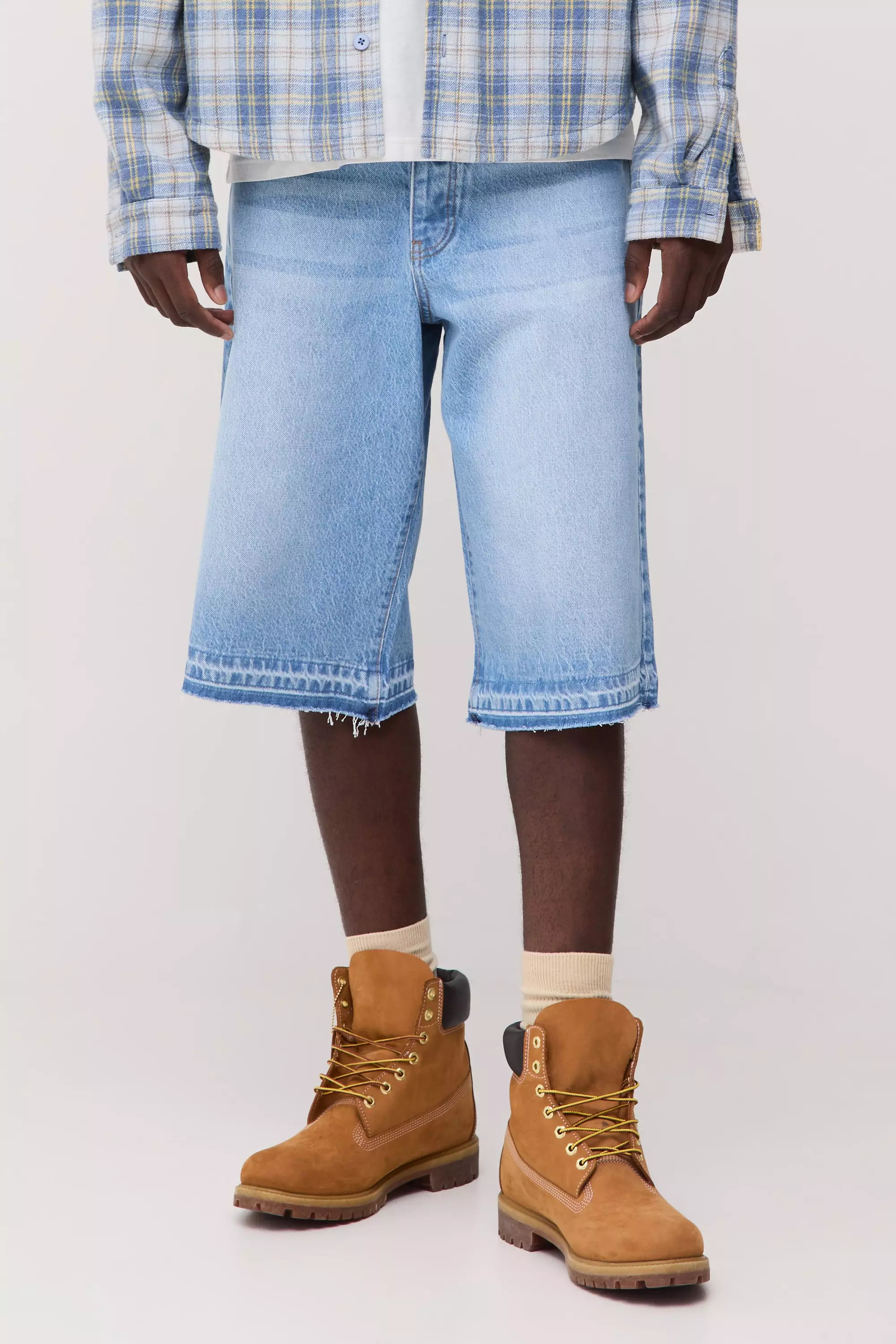 Washed Raw Hem Longline Jorts mid wash