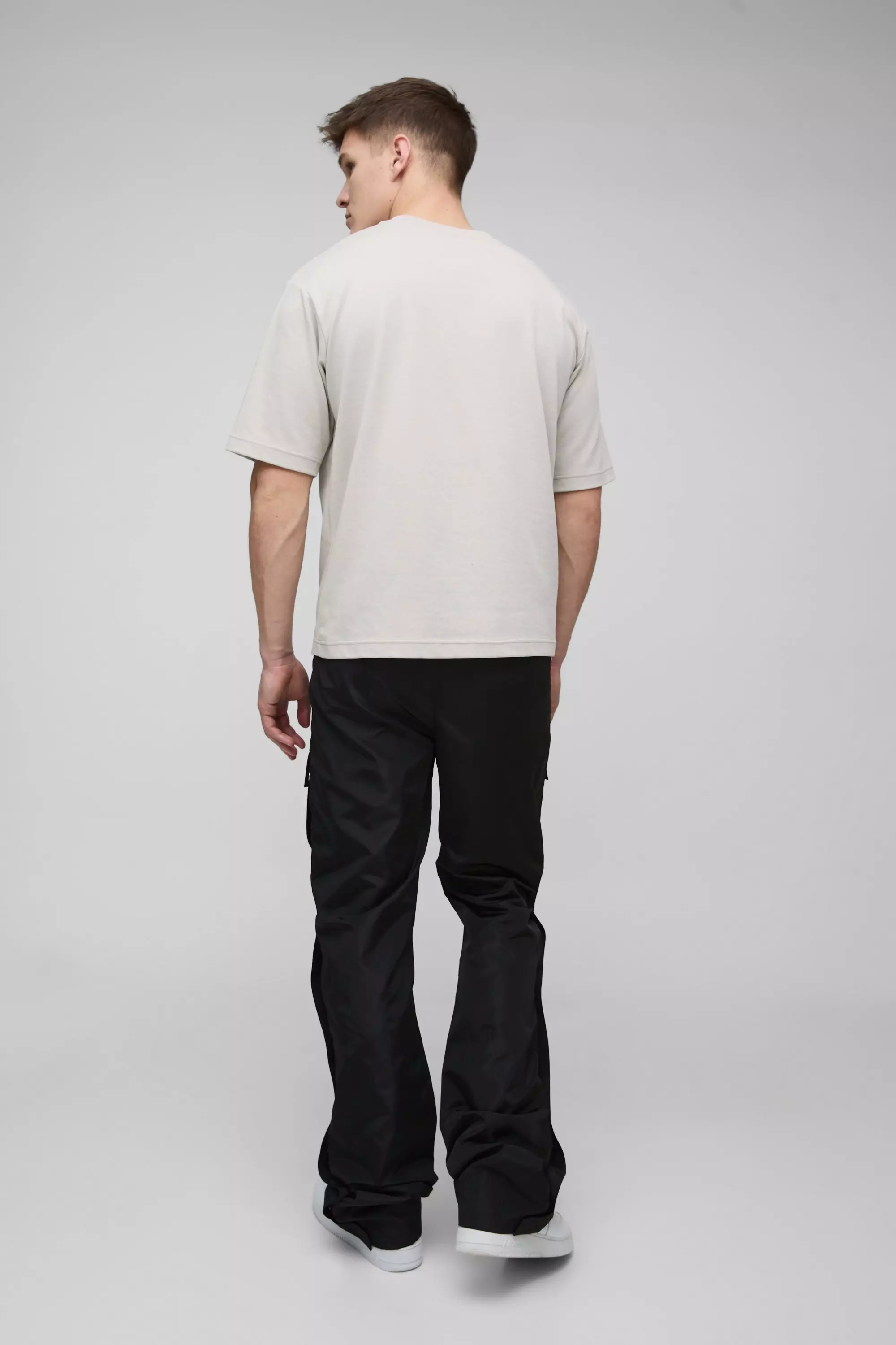 Tall Elasticated Waist Slim Flare Stacked Cargo Trousers | boohooMAN USA