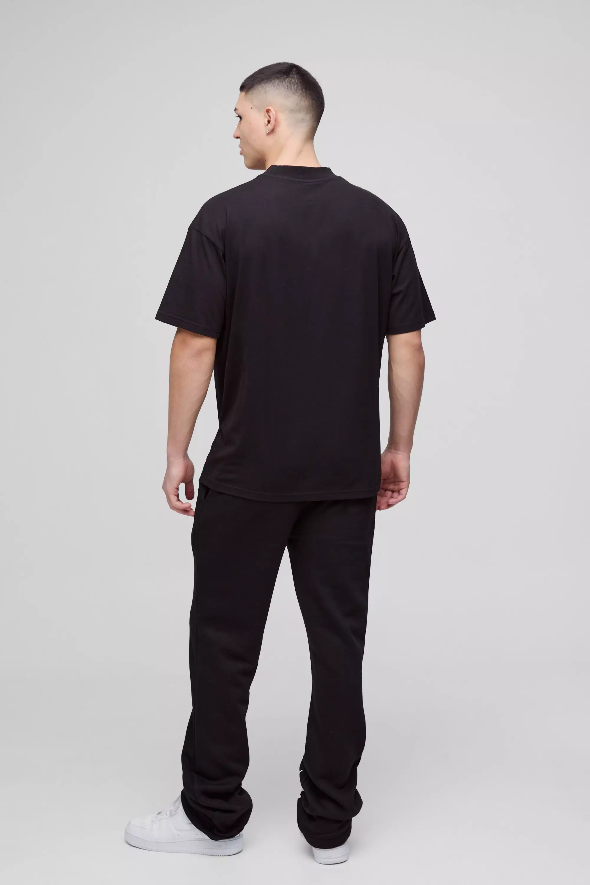 Slim-Fit Schlag-Jogginghose mit Print, Black alternatives Bild