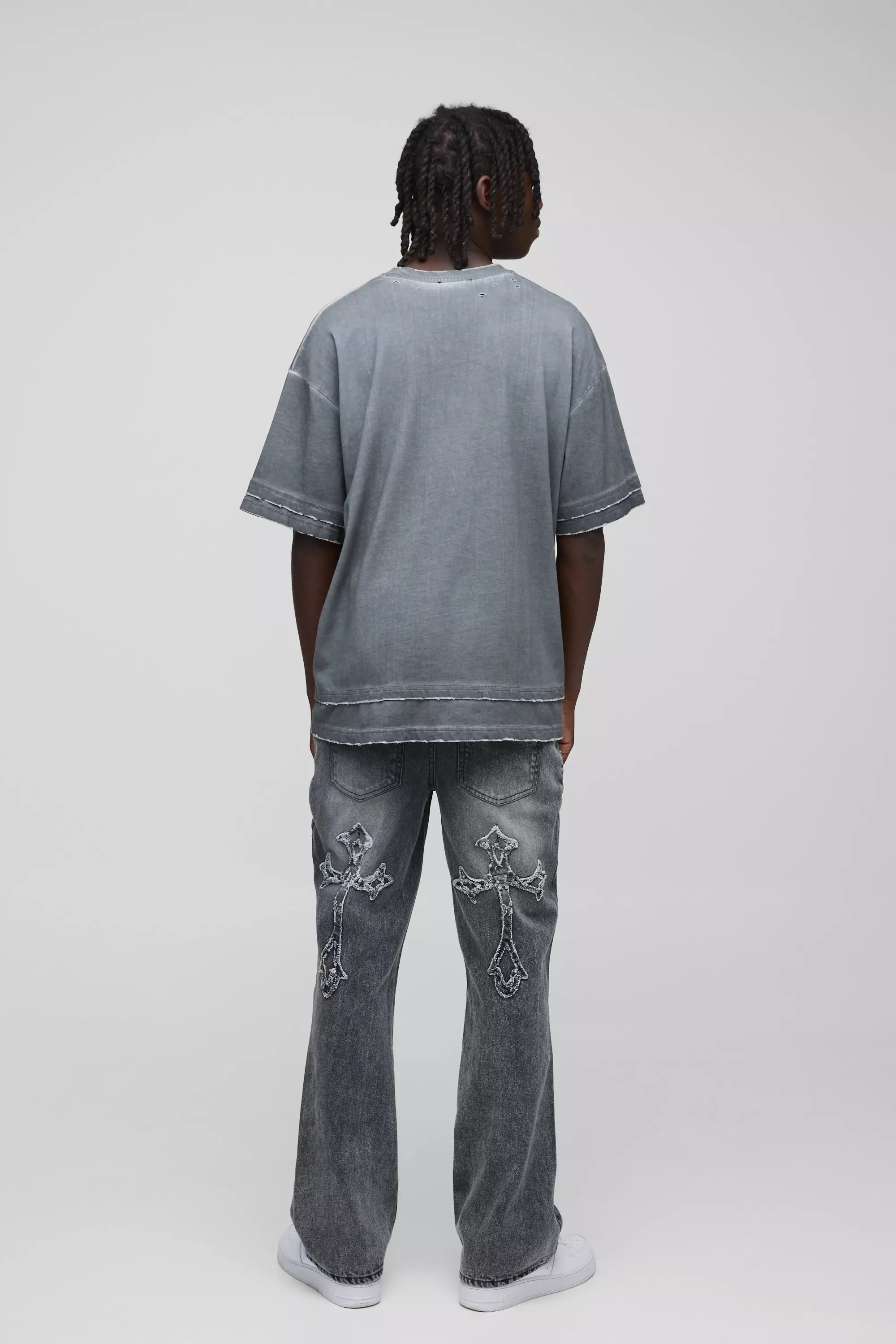 Slim Flared Acid Wash Cross Applique Gusset Jeans | boohooMAN UK