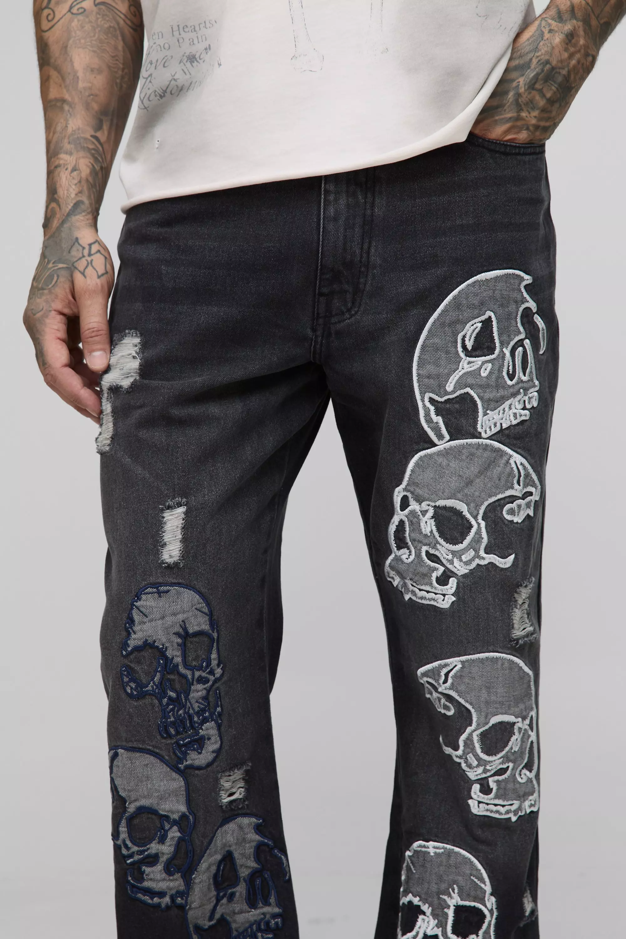 Tall Skull Applique Raw Hem Relaxed Flared Jeans | boohooMAN USA