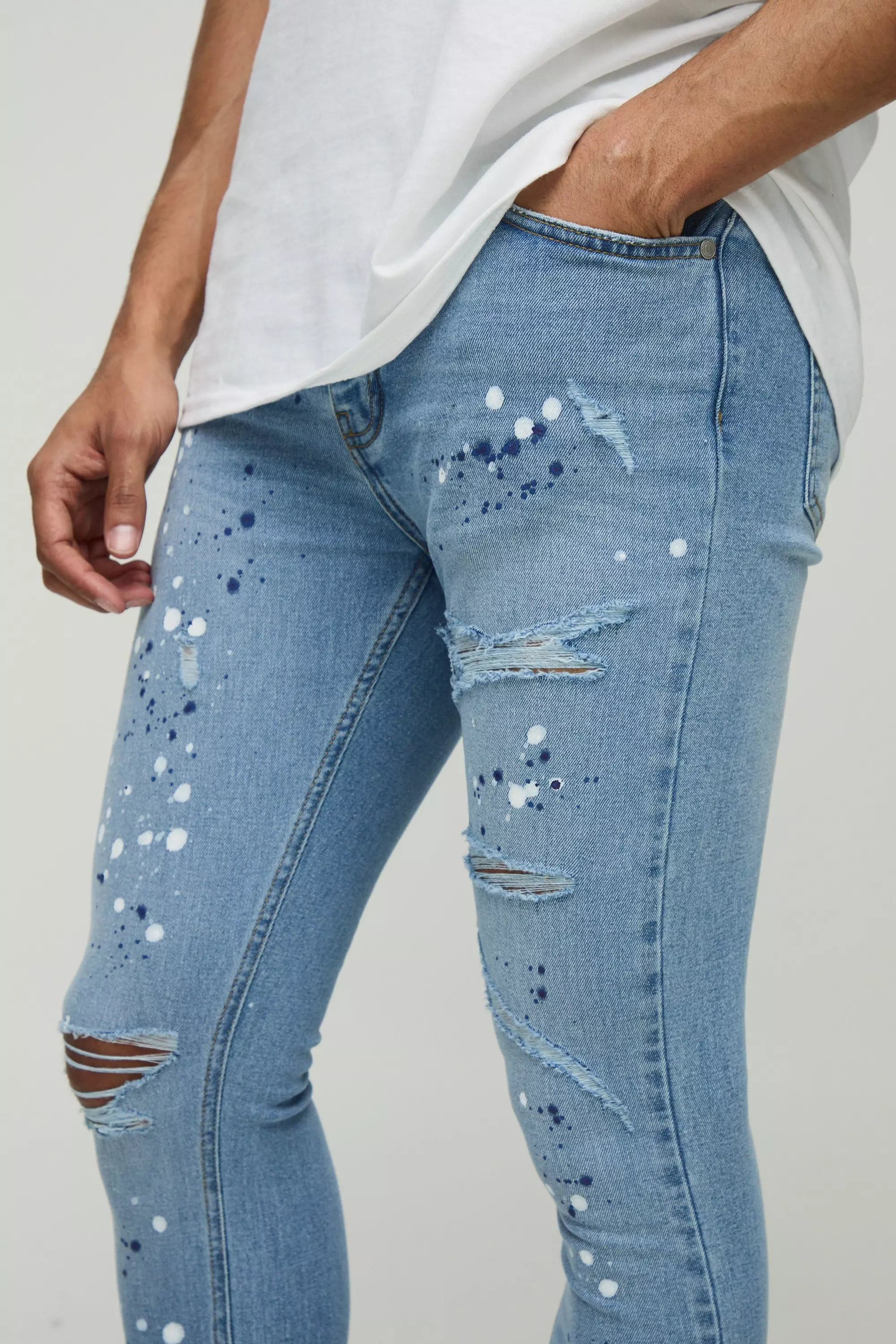 Super Skinny Rip & Repair Paint Splatter Denim Jeans | boohooMAN USA