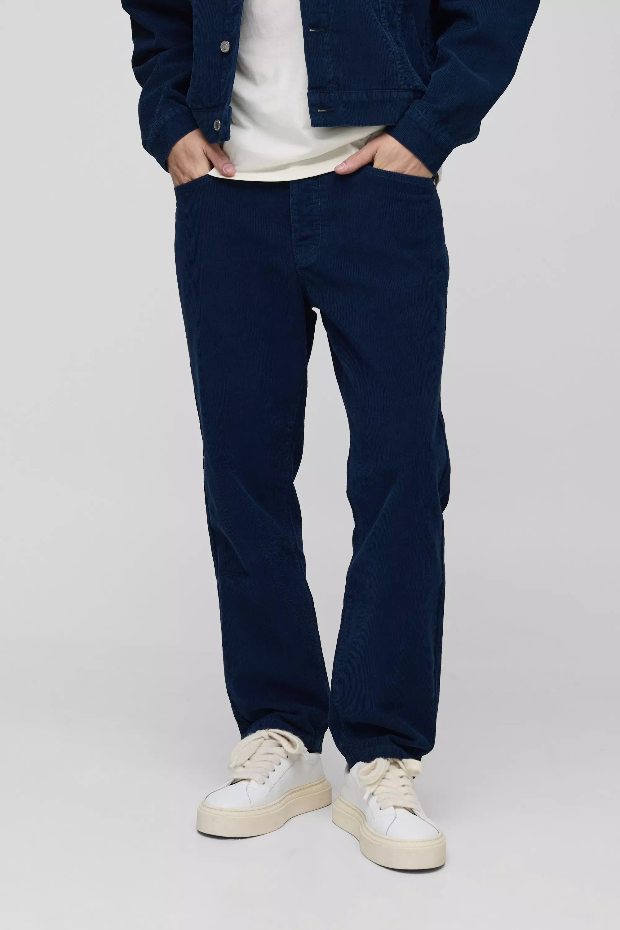 Tapered Navy Cord Trousers | boohooMAN USA