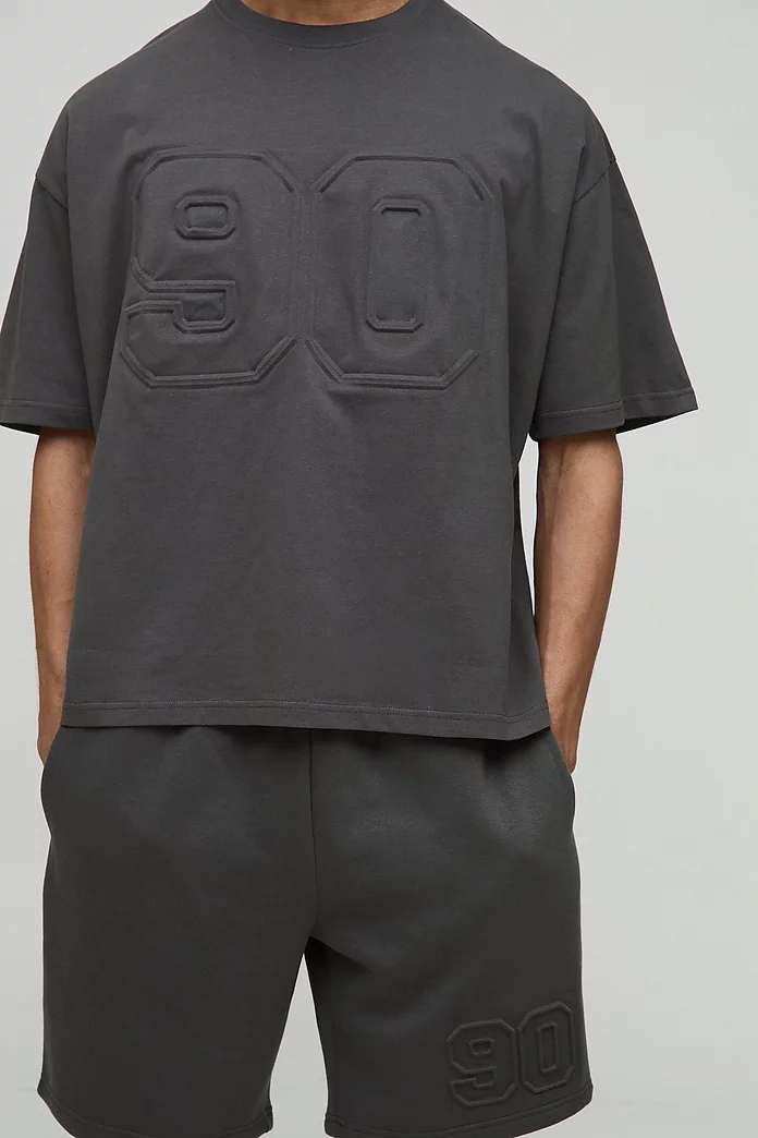 Oversized Boxy Varsity Embossed T-Shirt & Short Set Oversized Boxy Varsity Embossed T-Shirt & Short Set