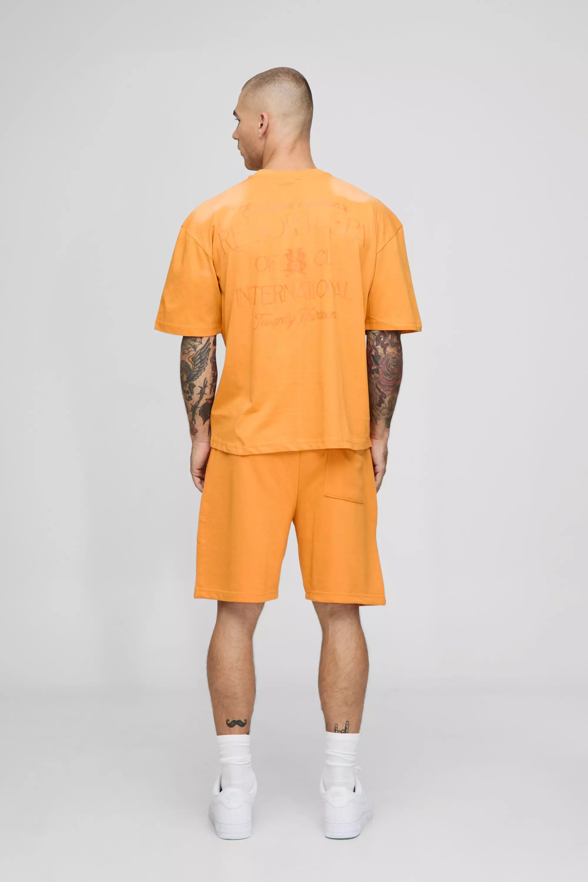 Relaxed Embroidered Spray Wash Mid Length Short | boohooMAN USA