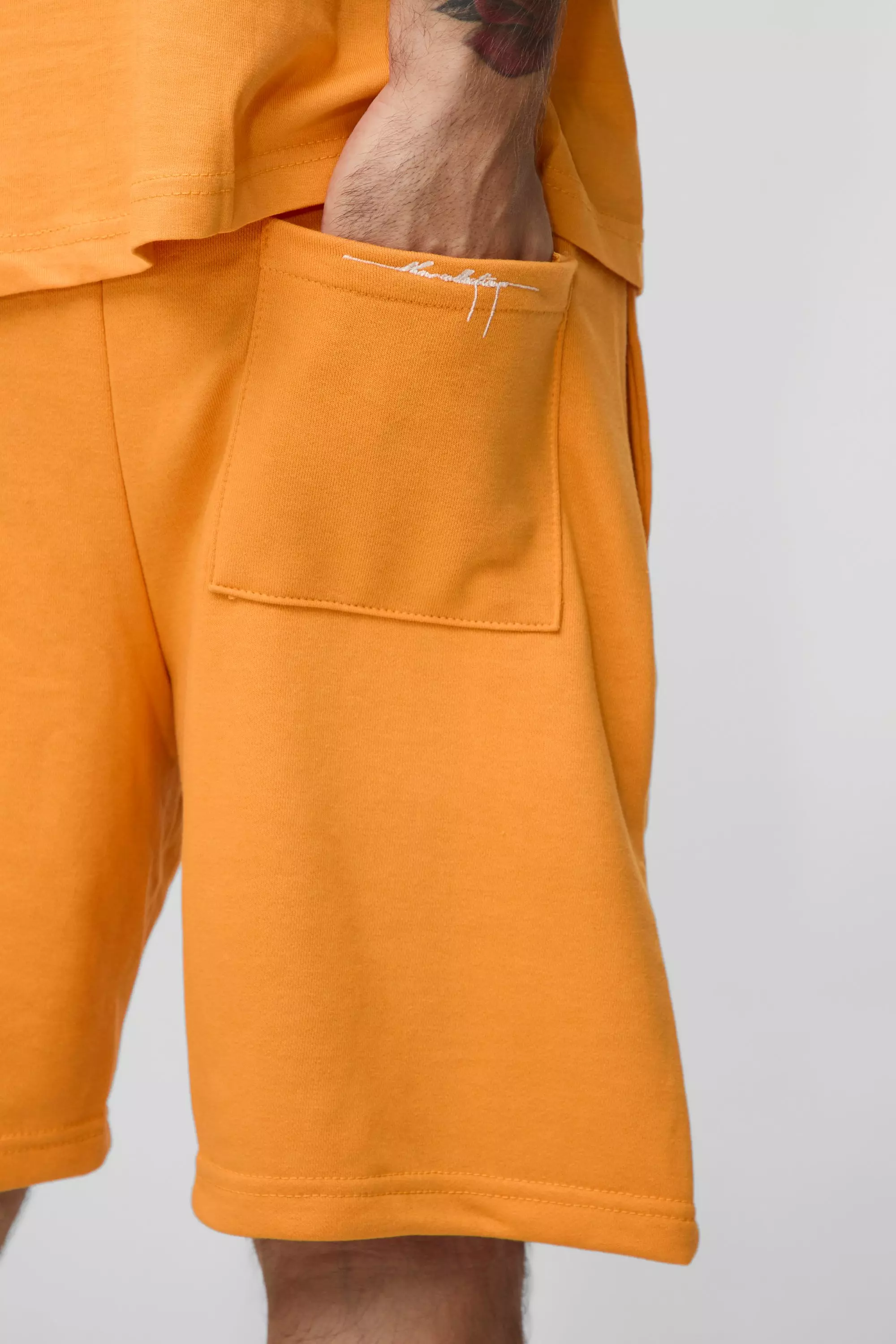 Relaxed Embroidered Spray Wash Mid Length Short | boohooMAN USA