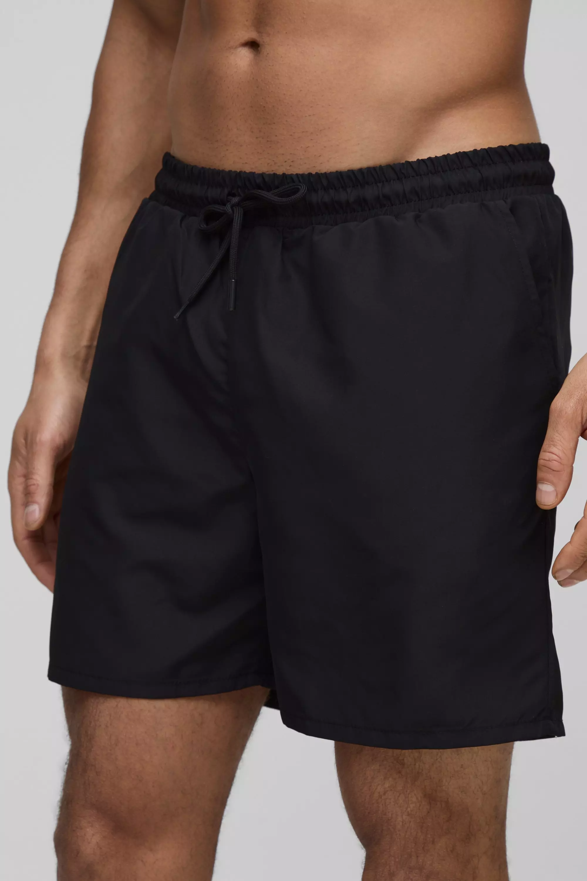 Black Man Embroidered Mid Length Swim Trunks alternative image