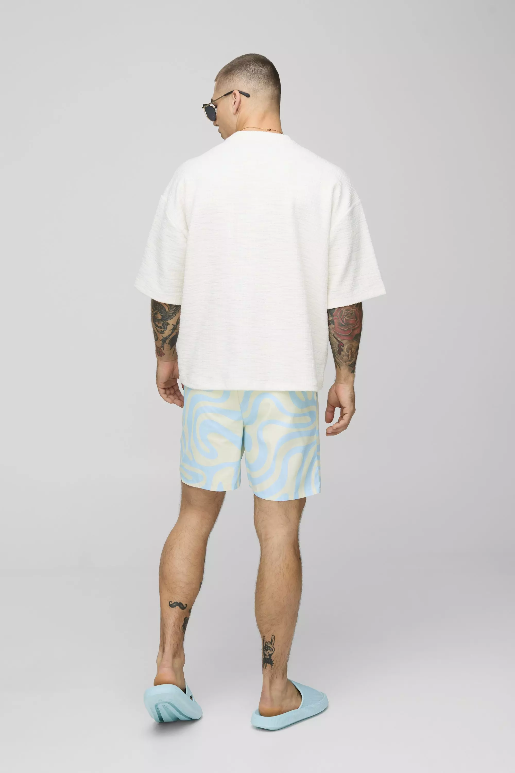 Mid Length Abstract Print Swim Trunks | boohooMAN USA