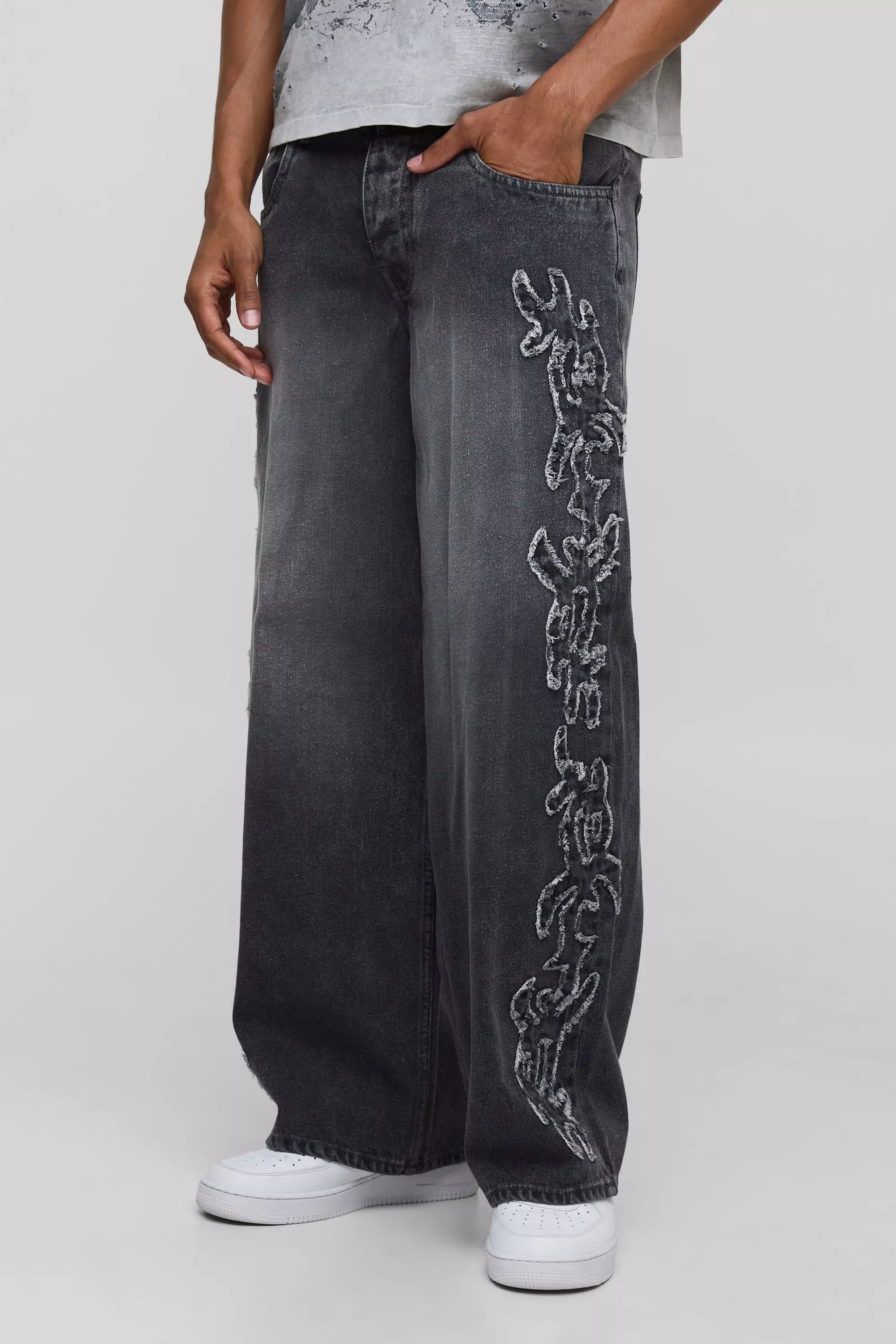 Baggy Fit Tribal Distressed Applique Washed Jeans | boohooMAN USA