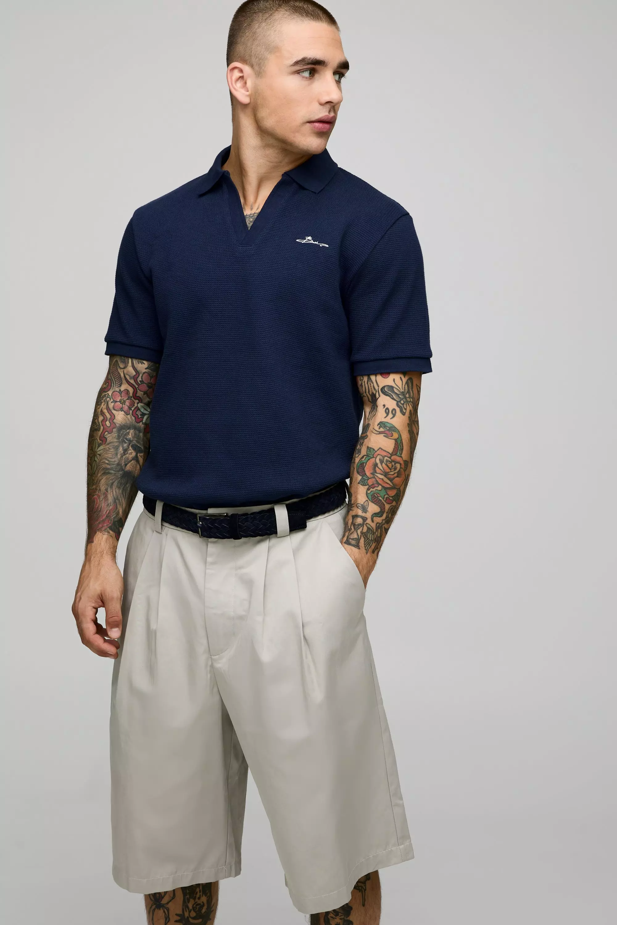 Slim Fit BM Signature Embroidered V Neck Textured Polo | boohooMAN USA