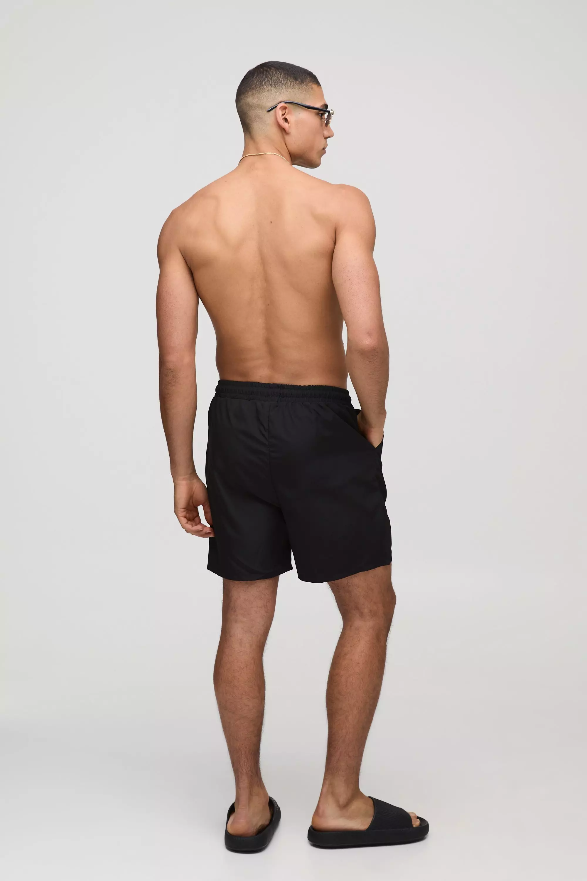 Branded Regular fit Mid length Embroidered Swim Shorts | boohooMAN USA