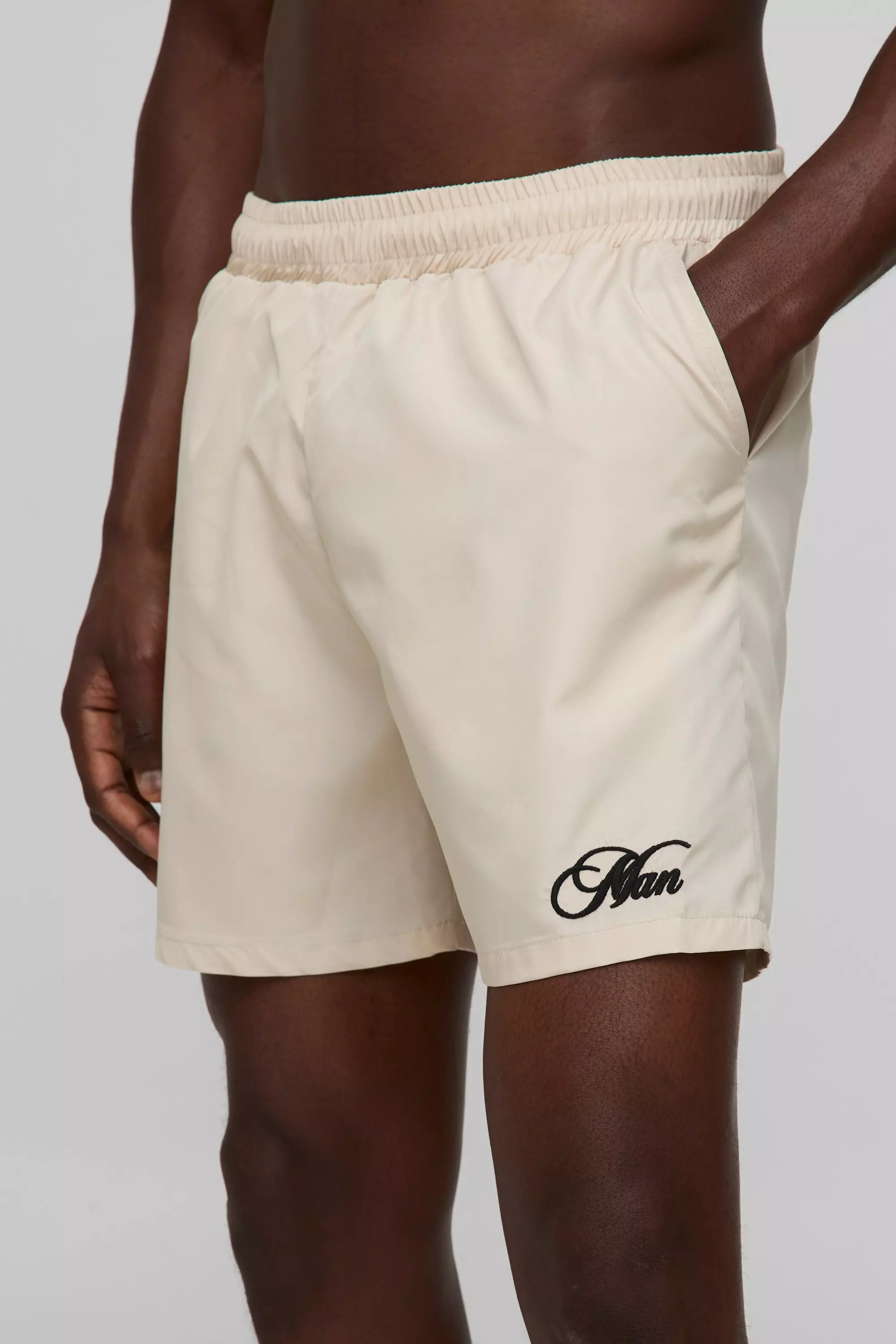 Branded Regular fit Mid length Embroidered Swim Shorts | boohooMAN USA