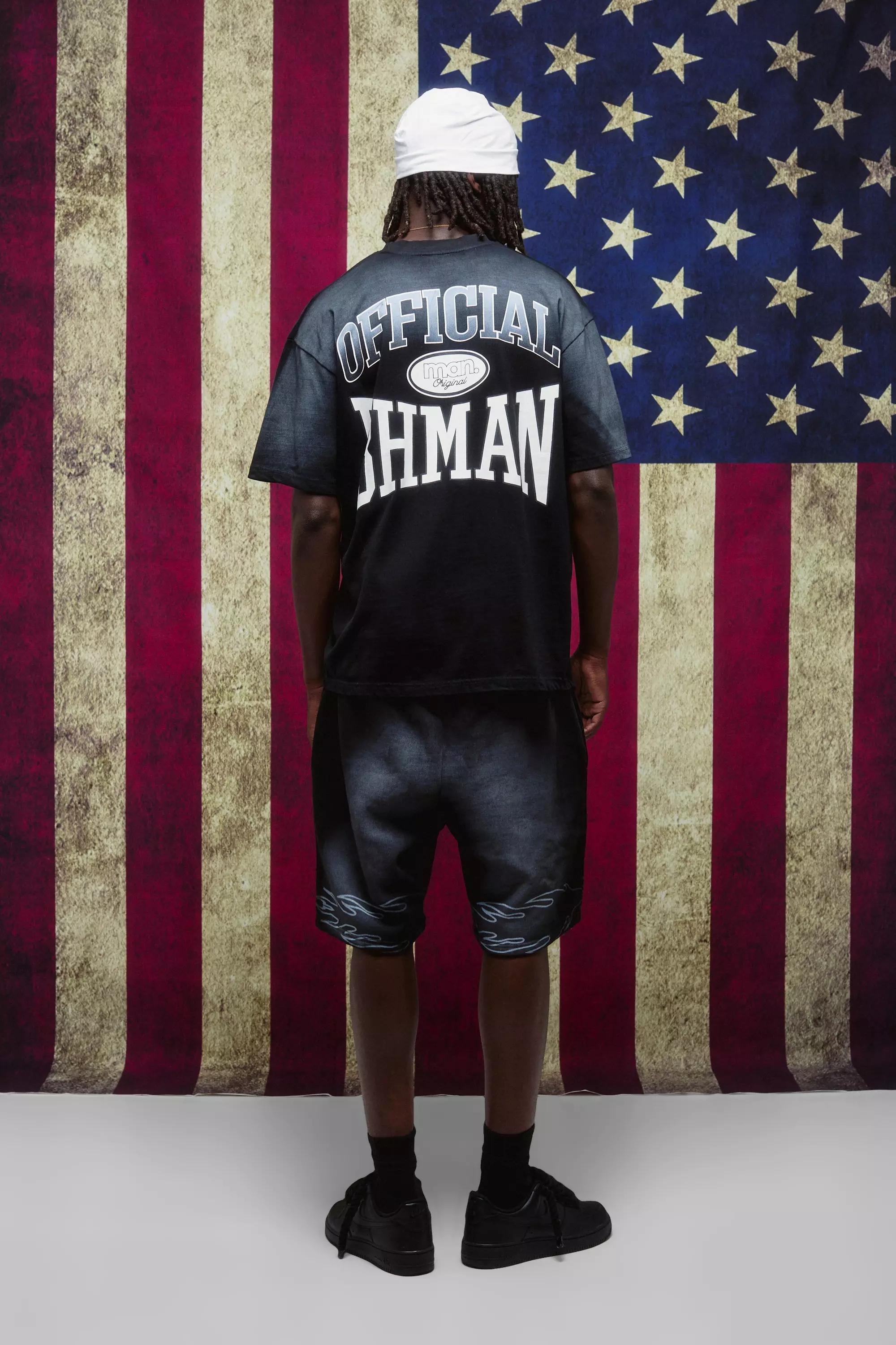 Black Relaxed Mid Length Spray Washed Star Shorts | boohooMAN USA