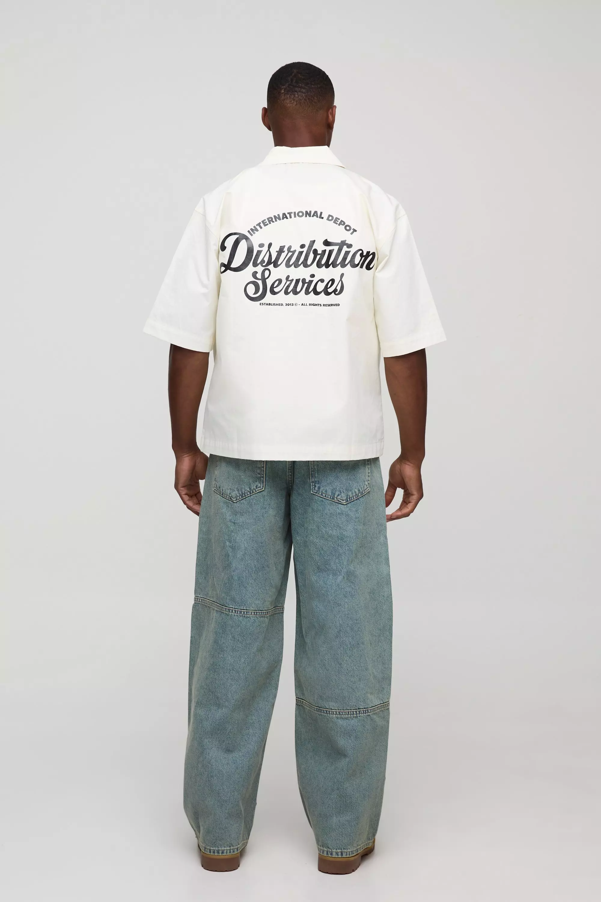 Baggy Fit Debossed Vintage Wash Jeans | boohooMAN USA