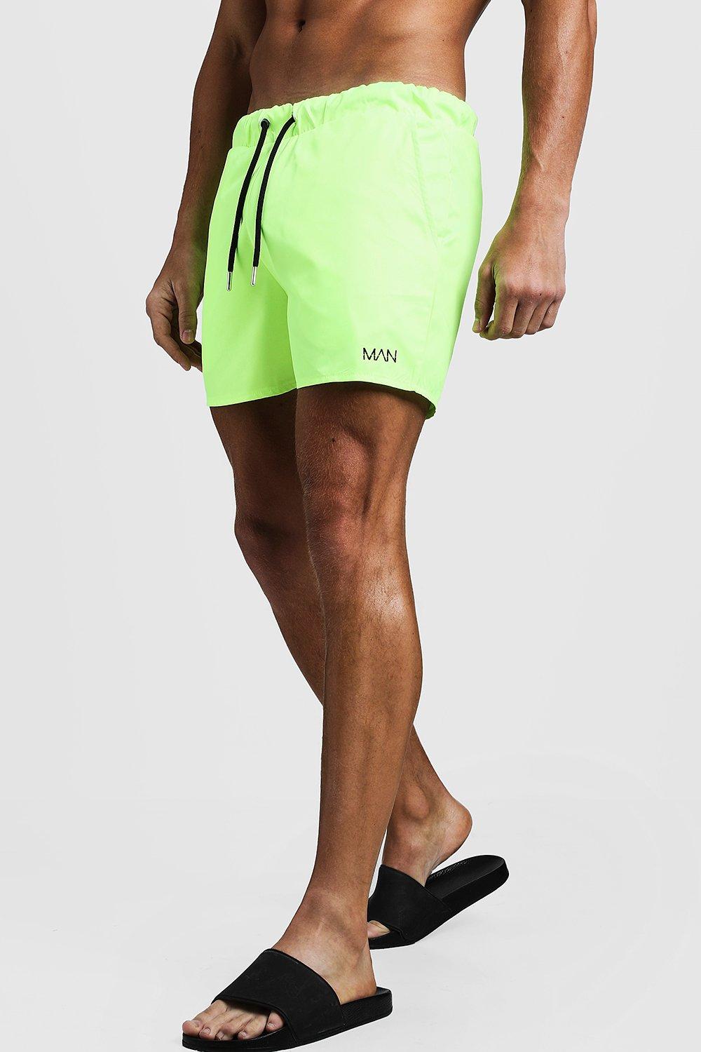 neon green swimming trunks