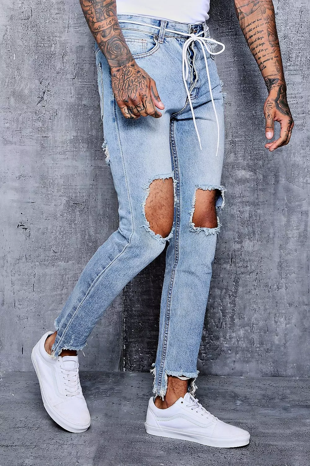 Skinny Fit Jeans With Ripped Knee And Hem alternative image